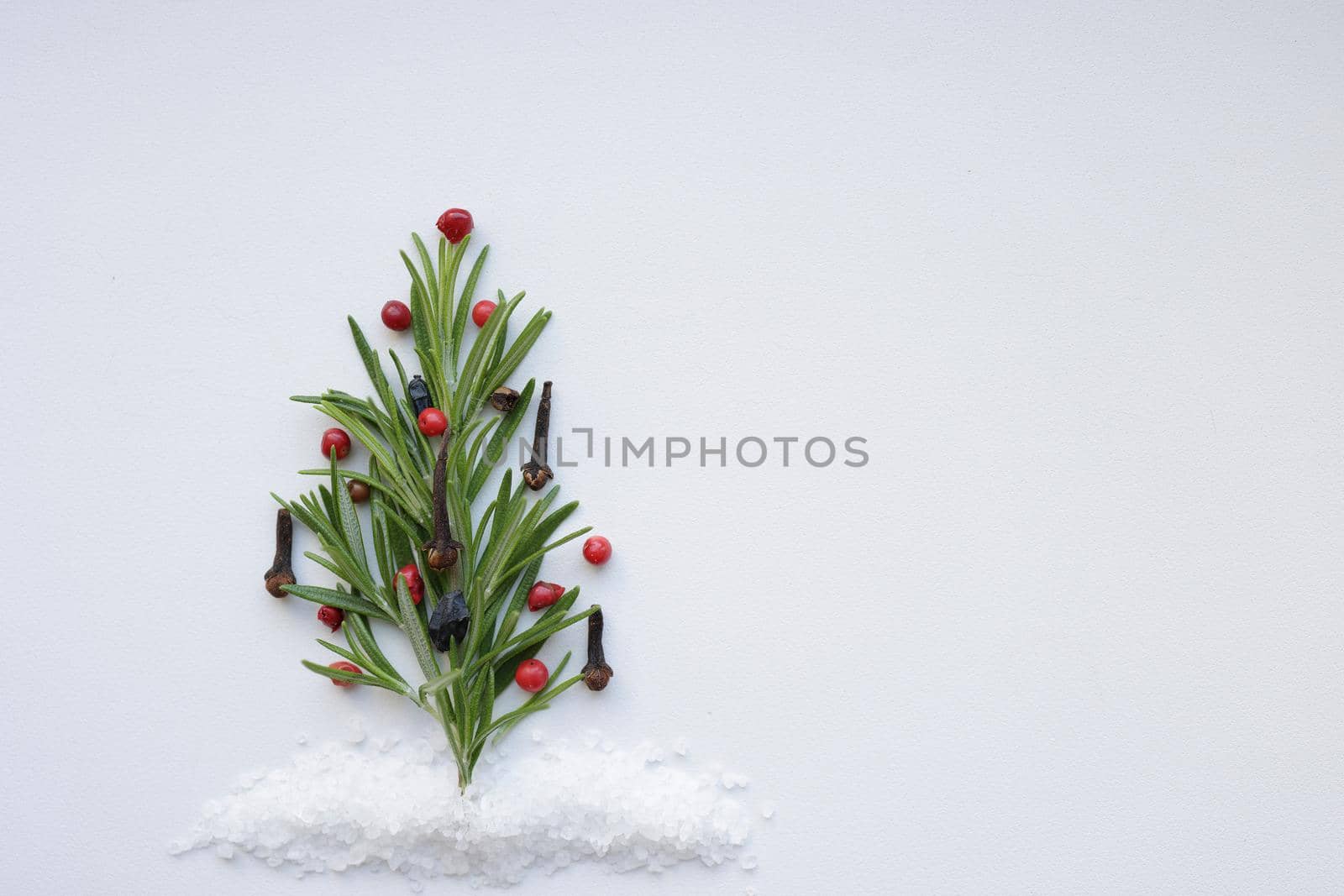 Minimalist Flat lay of herbs and spices in shape of a Christmas tree, Top view, Christmas concept. Christmas cooking. by Proxima13