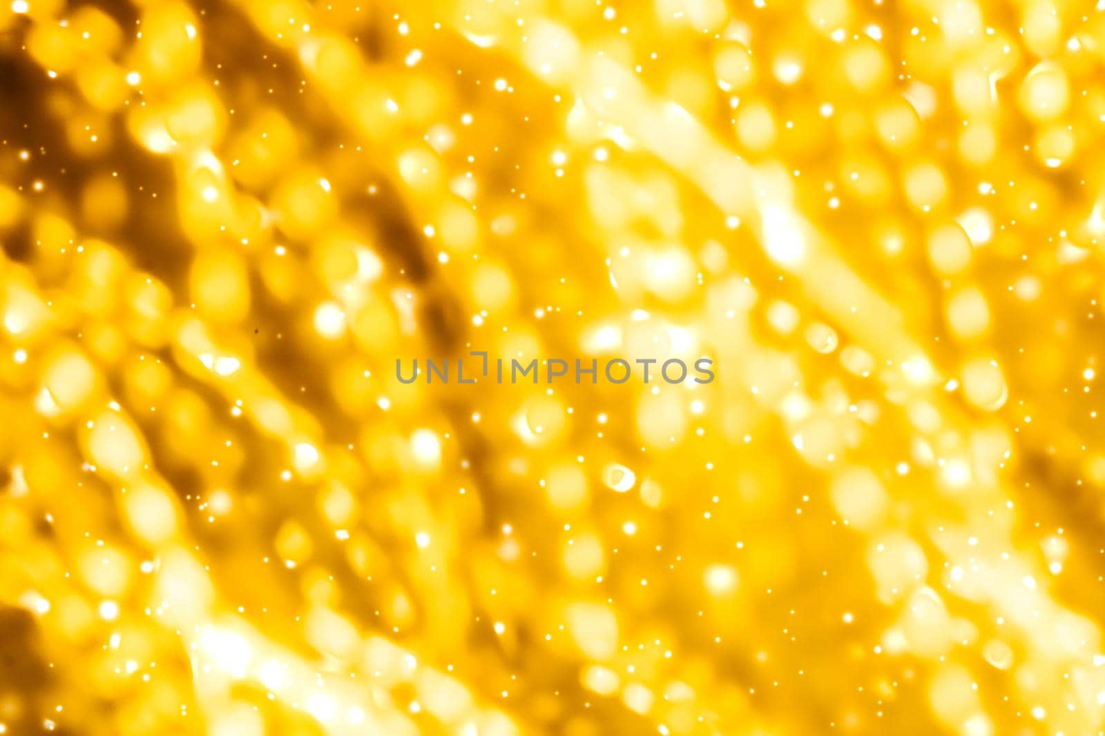 Golden Christmas lights, New Years Eve fireworks and abstract texture concept - Glamorous gold shiny glow and glitter, luxury holiday background