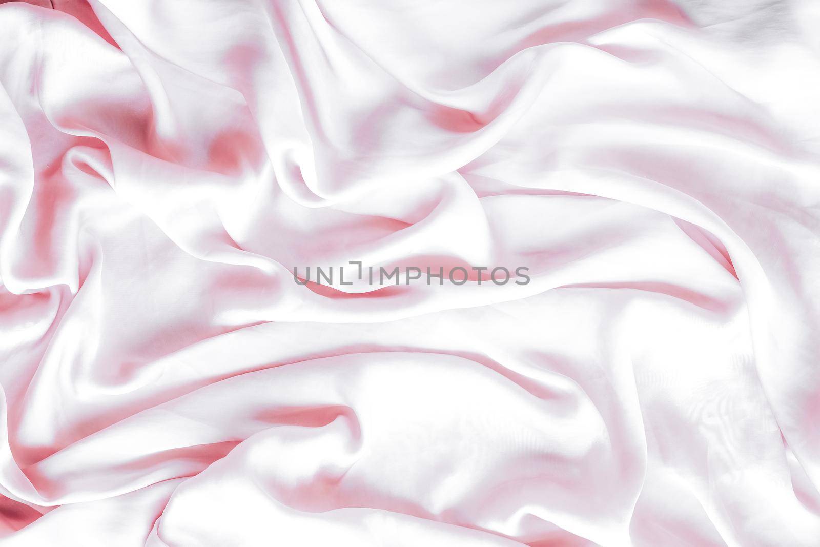 Elegant fabric texture, abstract backdrop and modern pastel colours concept - Pink soft silk waves, flatlay background