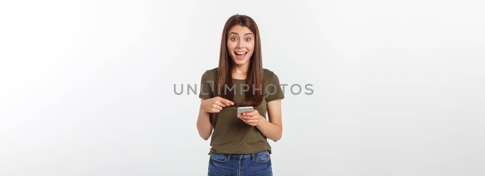 Laughing woman talking and texting on the phone isolated on a white background. by Benzoix