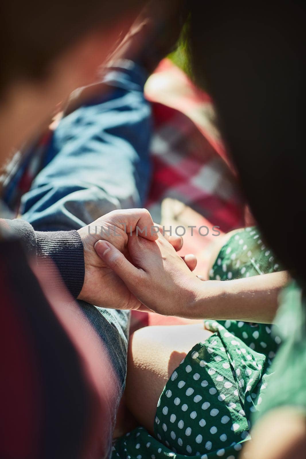 What would the world be without love. an affectionate couple holding hands outdoors