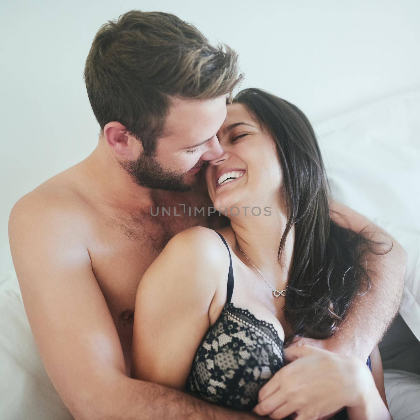 I want to grow old with you. a young couple sharing an intimate moment in their bedroom