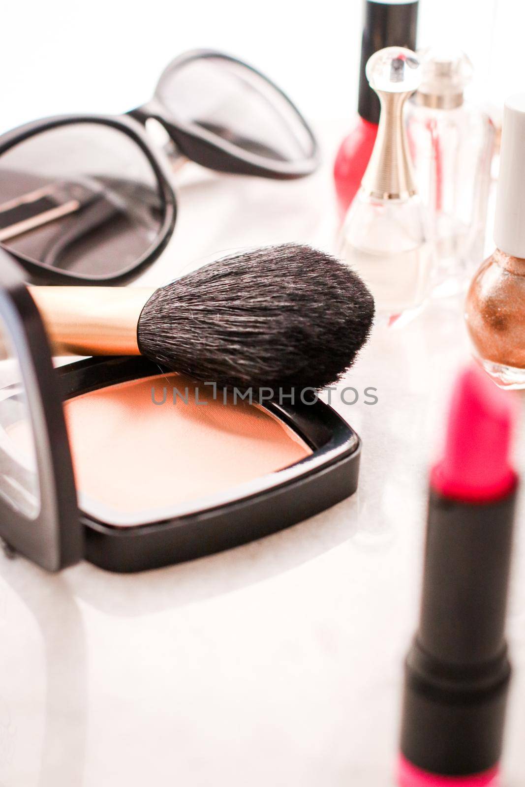 Luxury make-up and cosmetics on vanity table by Anneleven