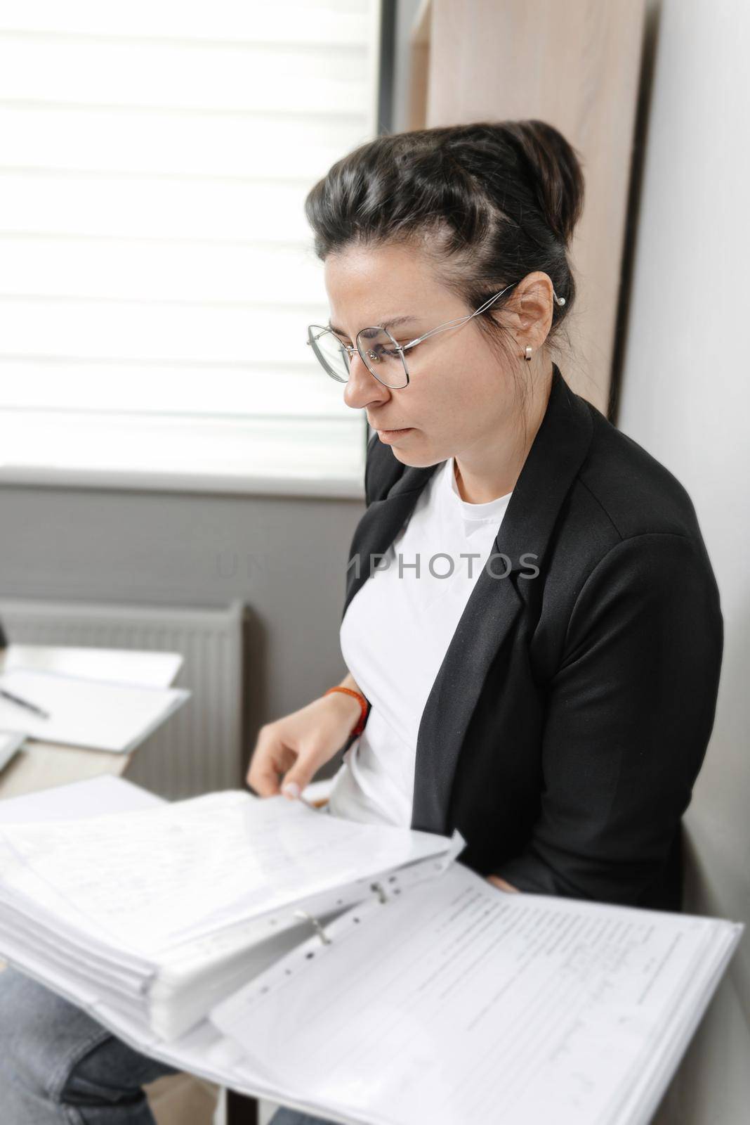 Accountant Clerk Clerk Woman. Bank counselor and auditor. Woman holding a binder of documents by gulyaevstudio