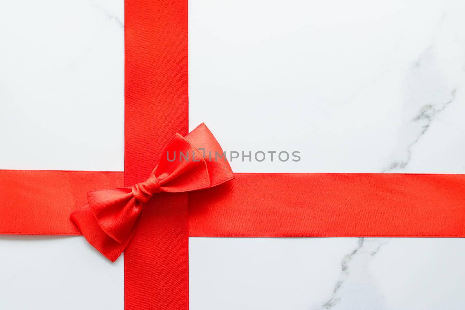 Holiday decor, feminine design and flatlay concept - Red silk ribbon on marble, top view