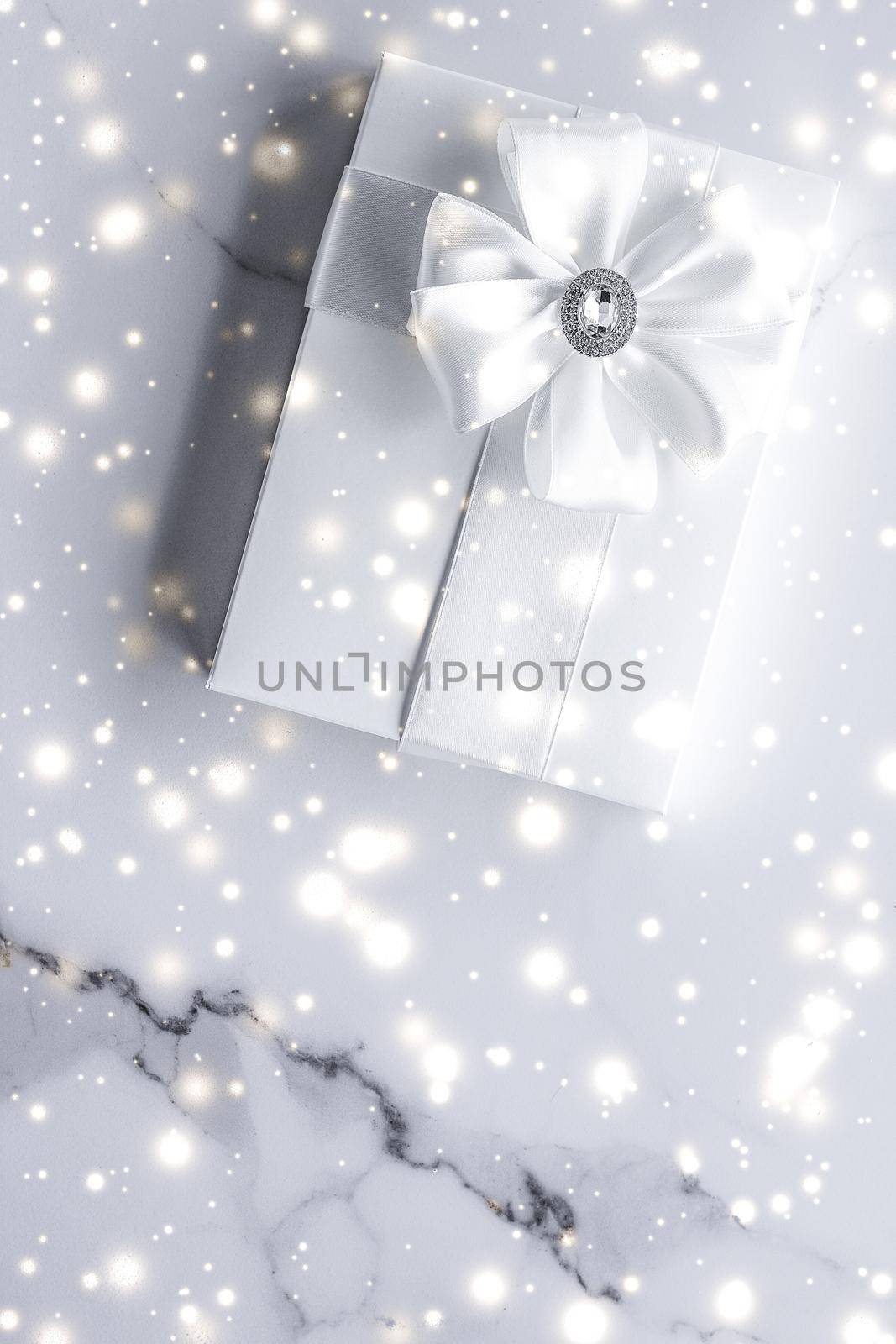 Luxury holiday gifts with white silk bow and ribbons on marble background, Christmas time surprise by Anneleven