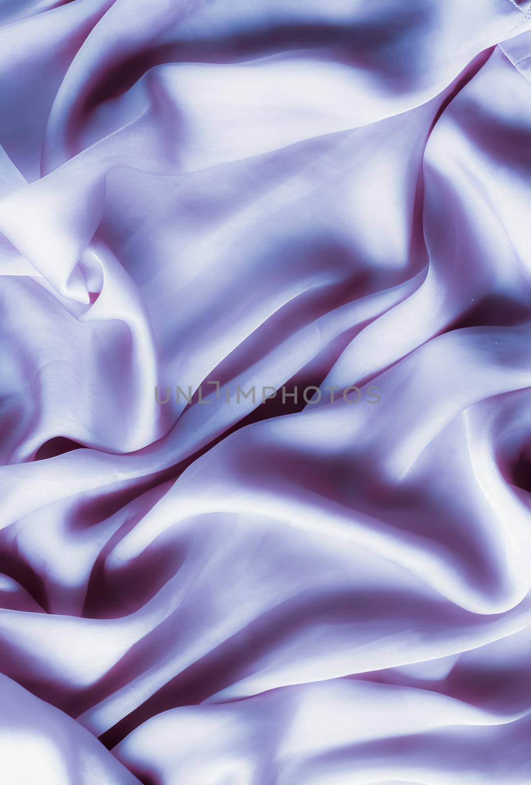 Elegant fabric texture, abstract backdrop and modern pastel colours concept - Purple soft silk waves, flatlay background