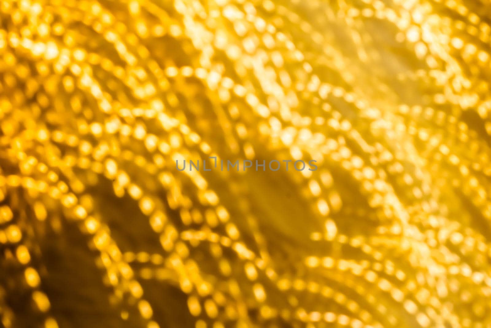 Golden Christmas lights, New Years Eve fireworks and abstract texture concept - Glamorous gold shiny glow and glitter, luxury holiday background