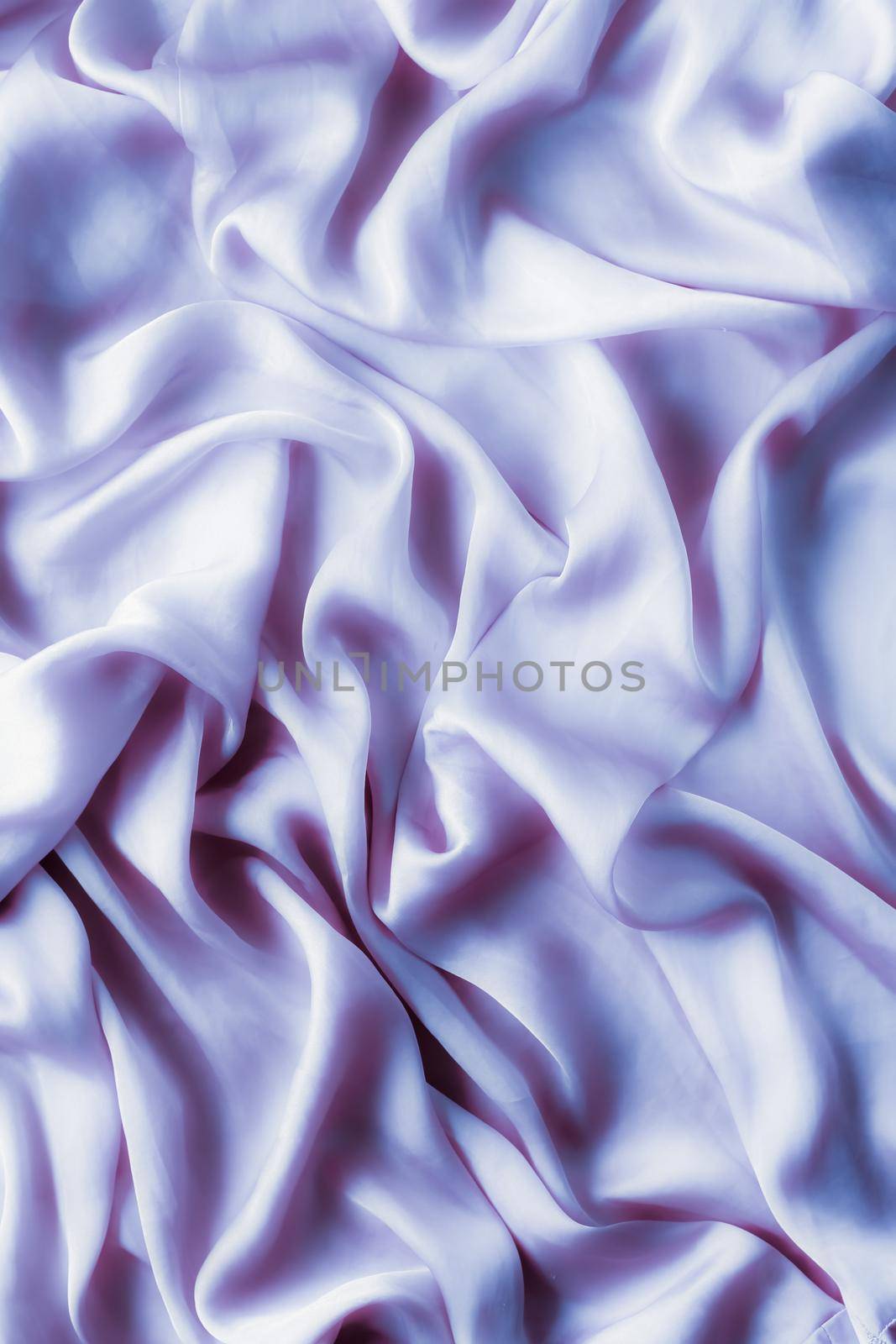 Elegant fabric texture, abstract backdrop and modern pastel colours concept - Purple soft silk waves, flatlay background