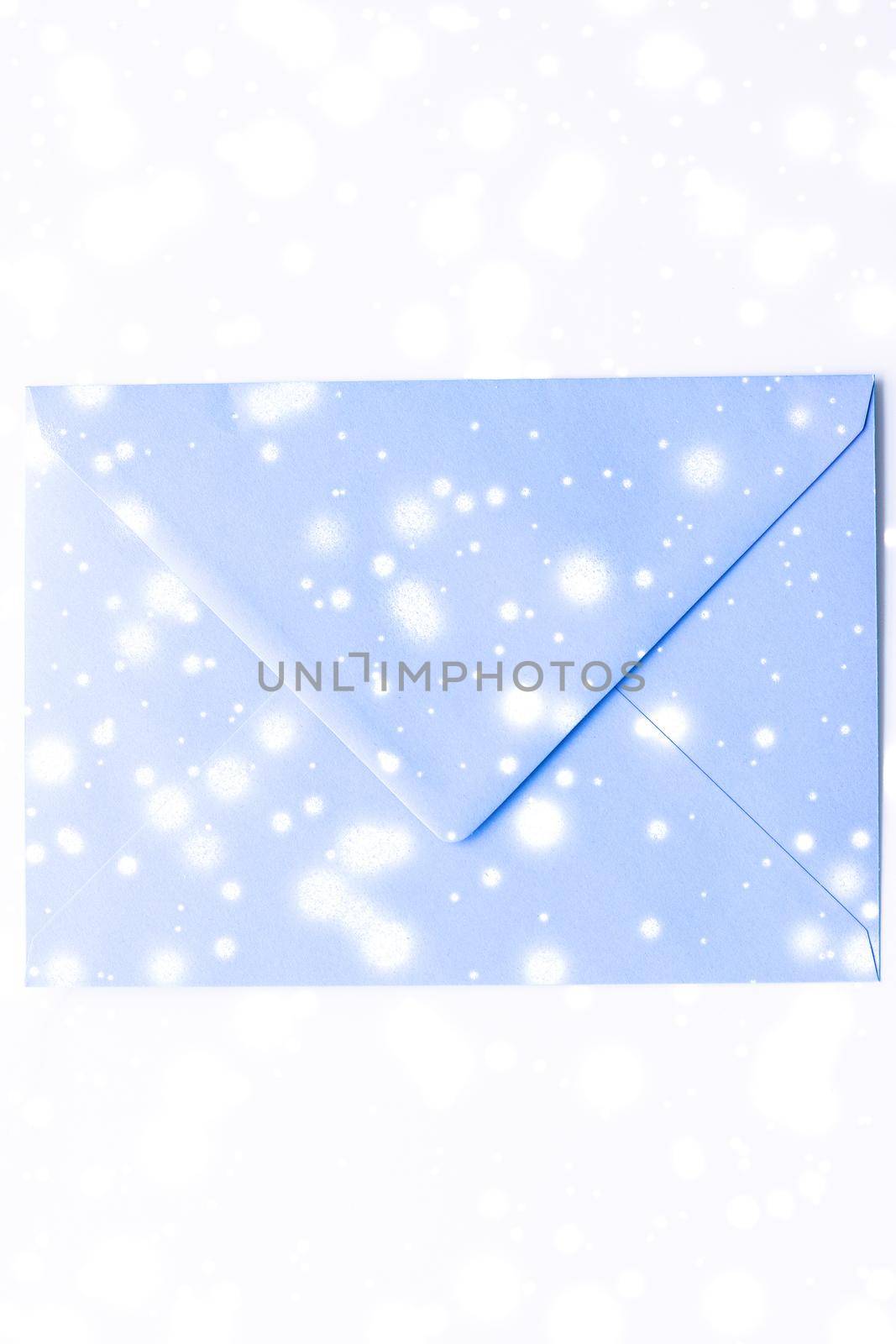 Winter holiday blank paper envelopes on marble with shiny snow flatlay background, love letter or Christmas mail card design by Anneleven