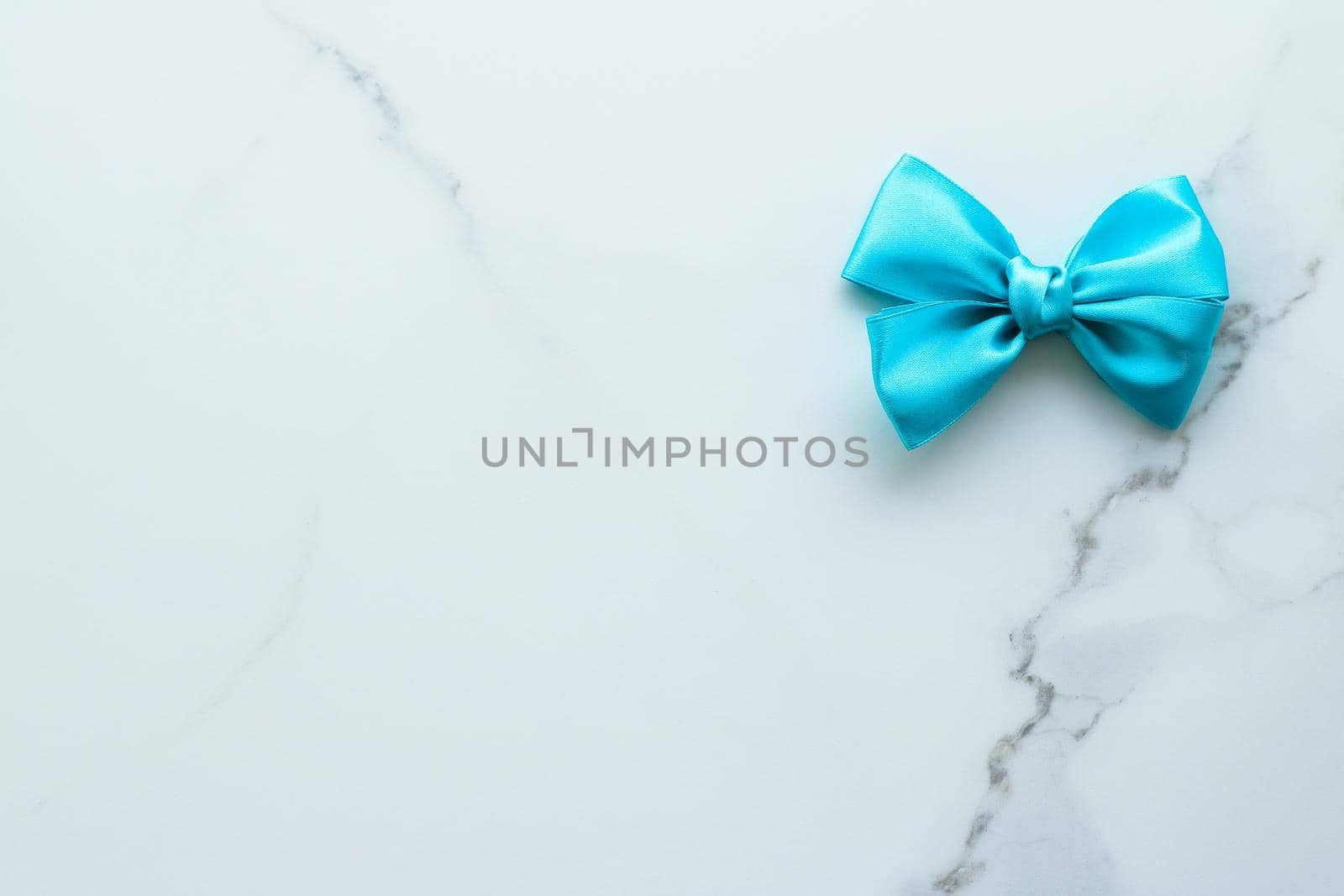 Holiday decor, feminine design and flatlay concept - Blue silk ribbon on marble, top view