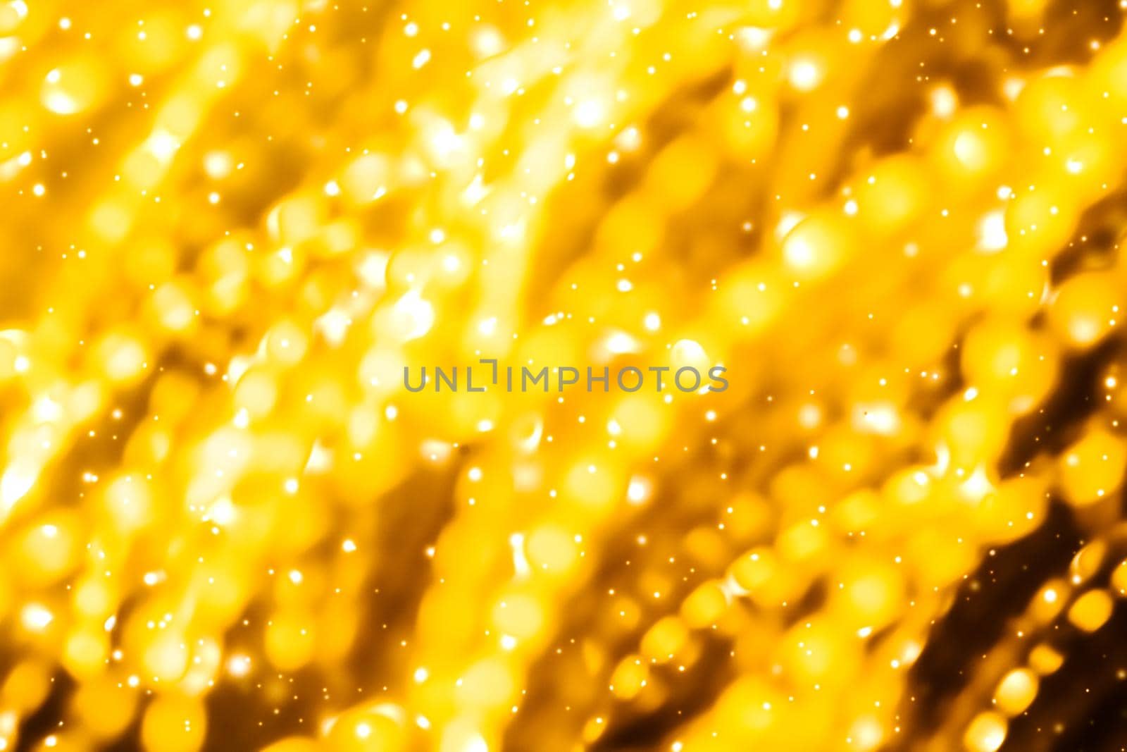 Golden Christmas lights, New Years Eve fireworks and abstract texture concept - Glamorous gold shiny glow and glitter, luxury holiday background