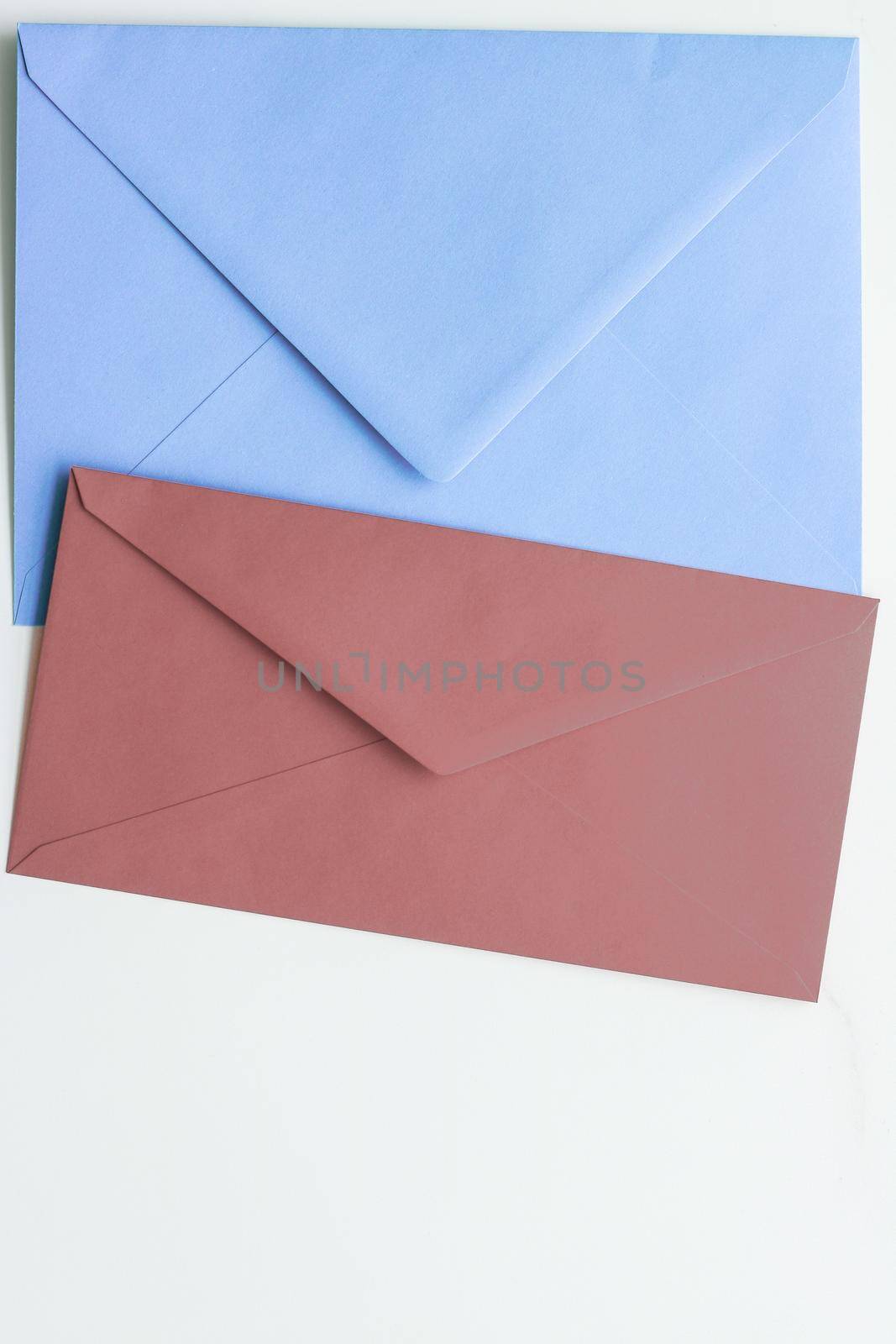 Blank paper envelopes on marble flatlay background, holiday mail letter or post card message design by Anneleven