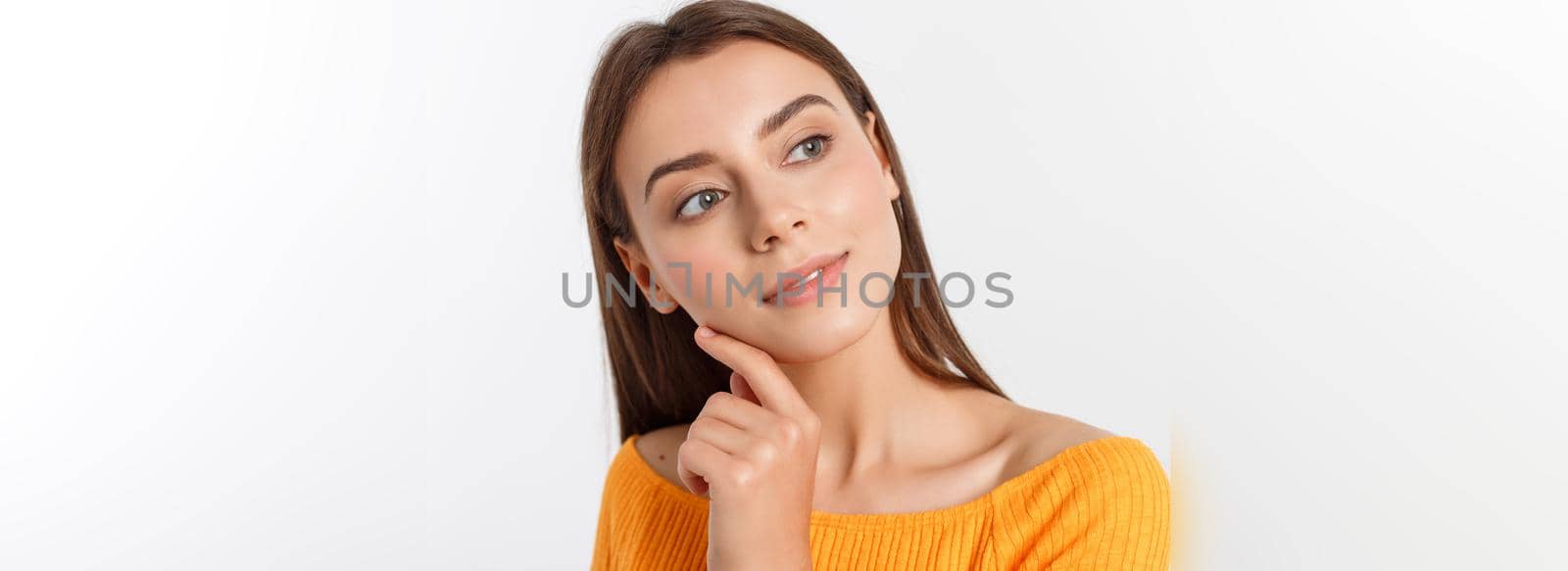 friendly smiling young woman with beatiful face portrait studio shot.