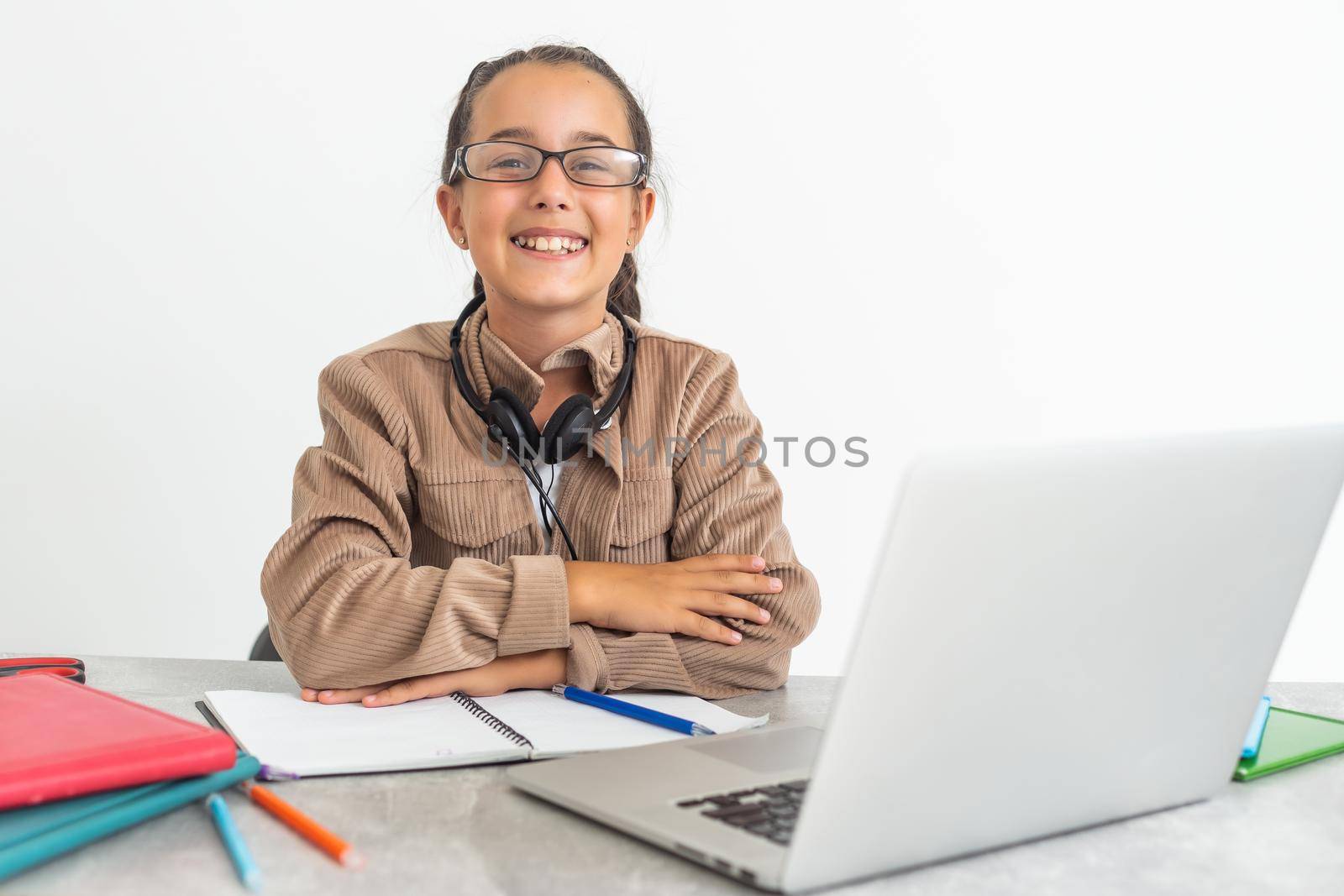 Beautiful dark-eyed dark-haired girl smiling and studying.