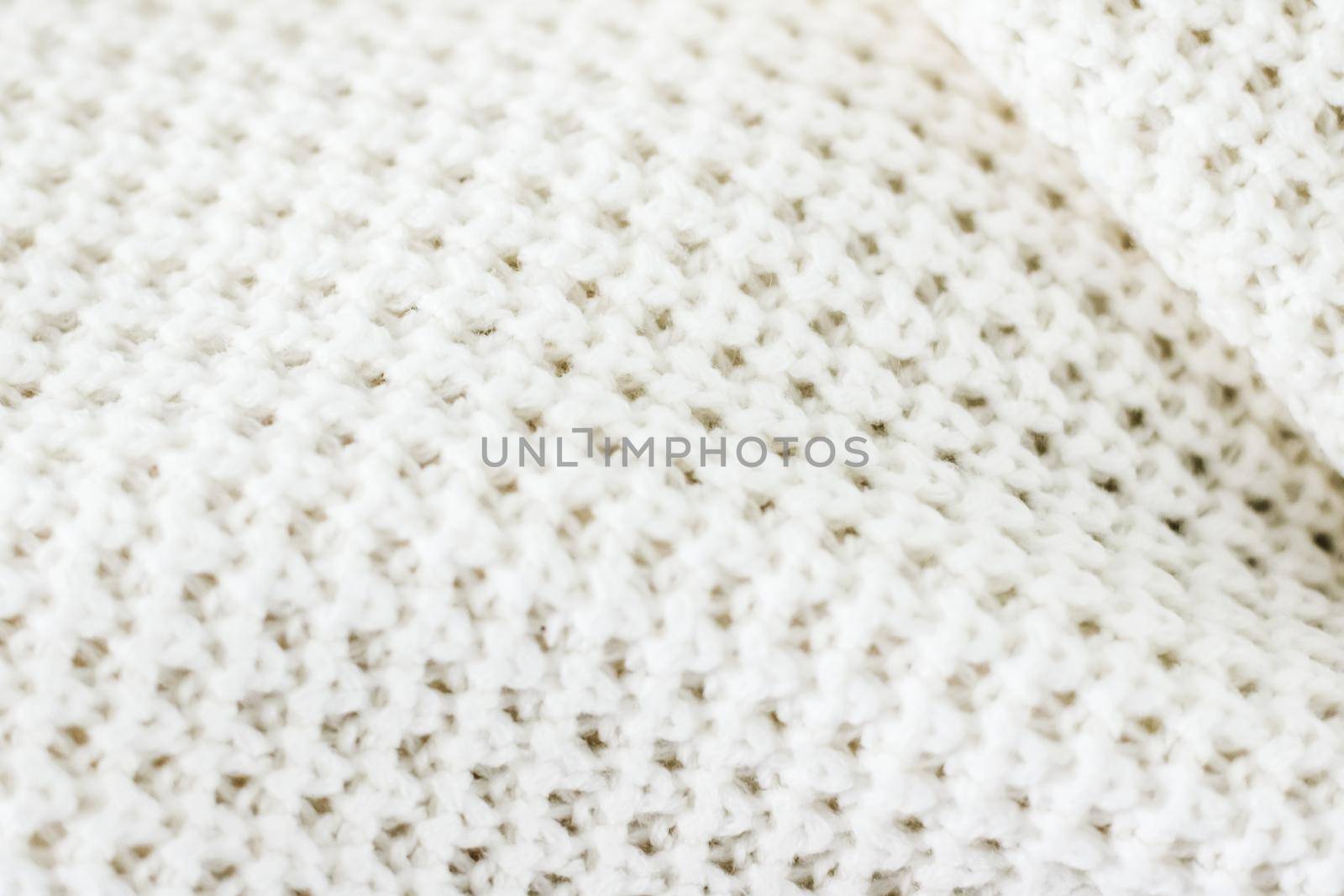 Knitwear, fabric textures and handmade items concept - Warm knitted clothes, soft and white