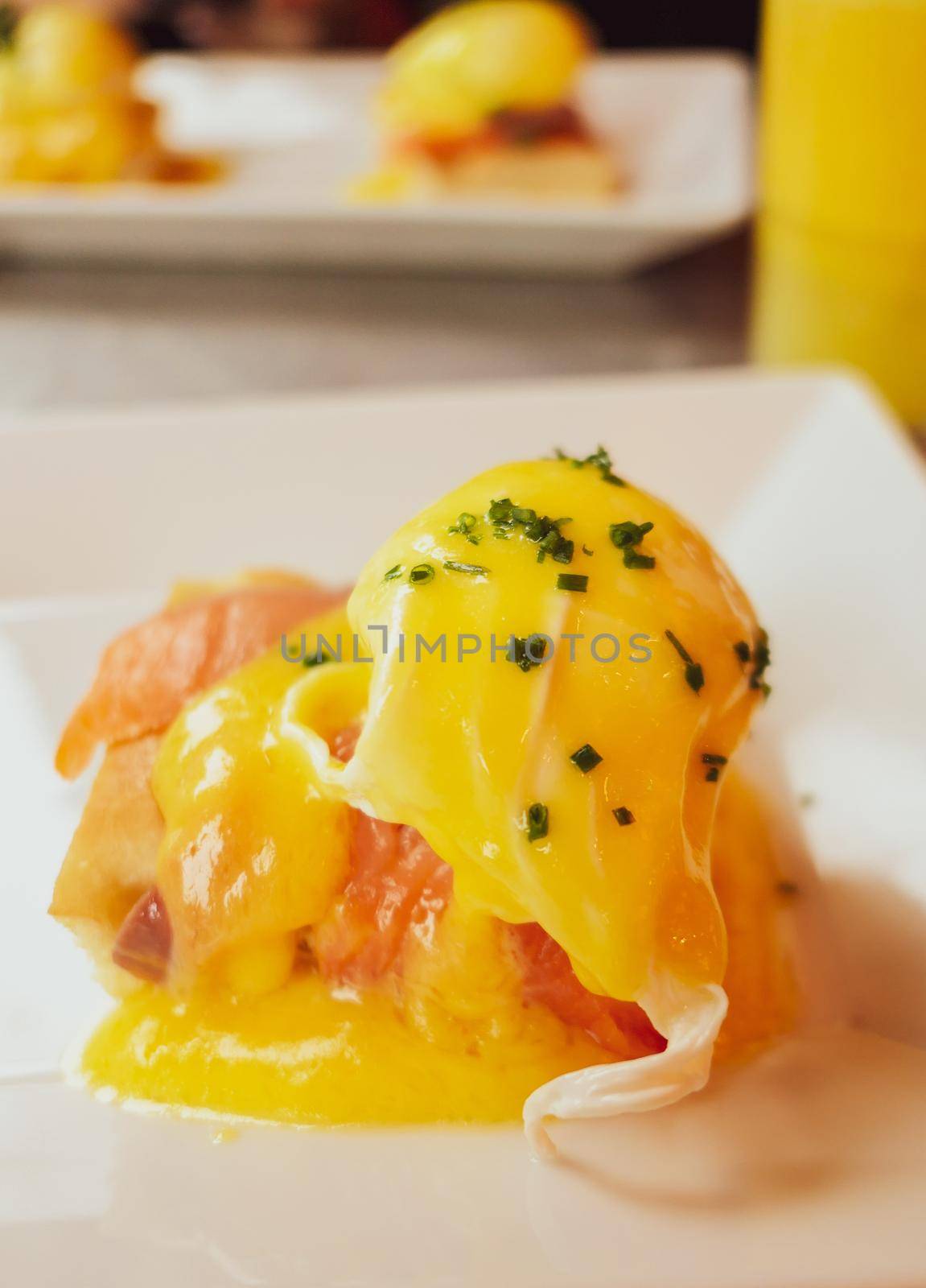 Restaurant service, food recipes and breakfast concept - Poached egg with salmon for brunch in a luxury restaurant