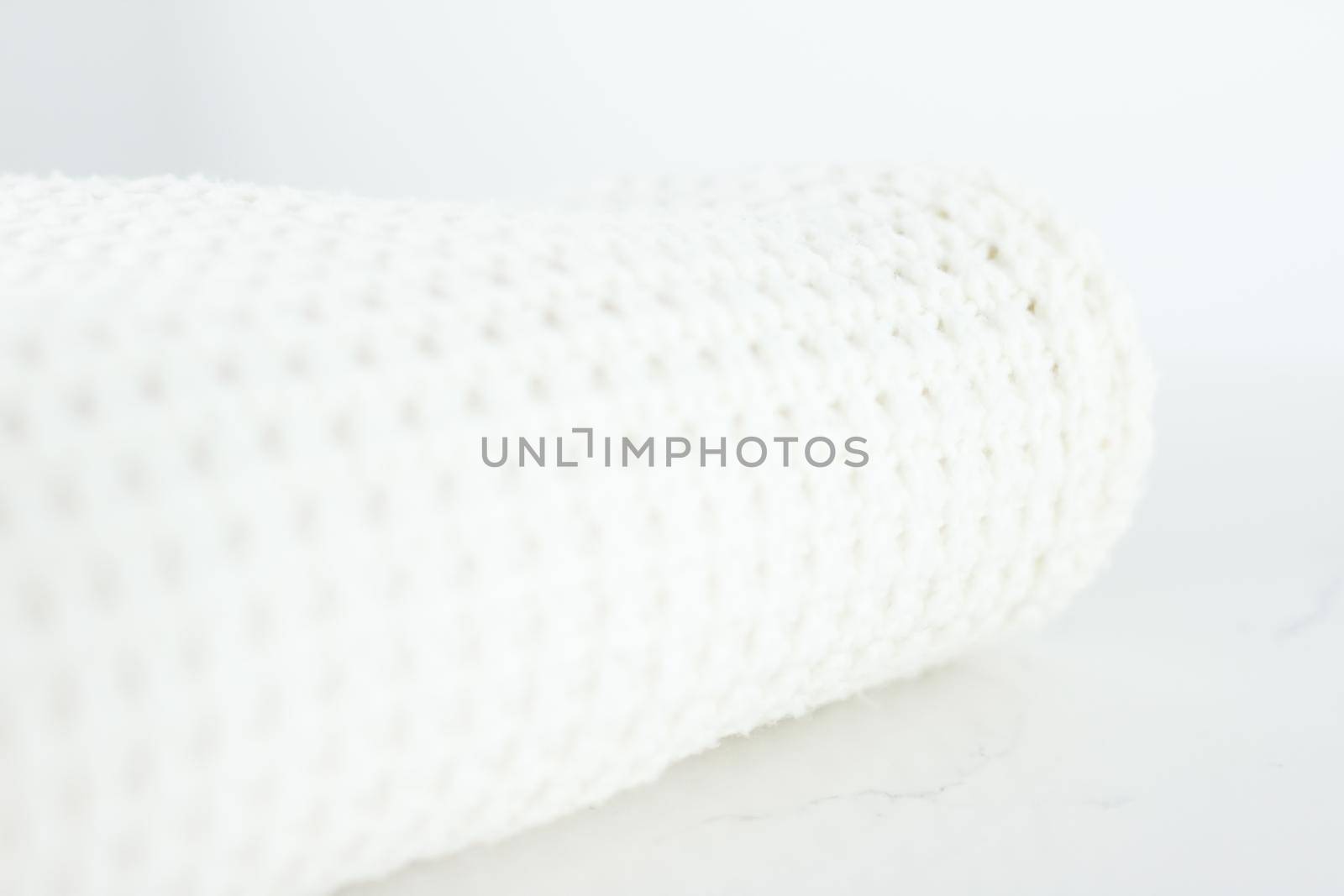 Knitwear, fabric textures and handmade items concept - Warm knitted clothes, soft and white