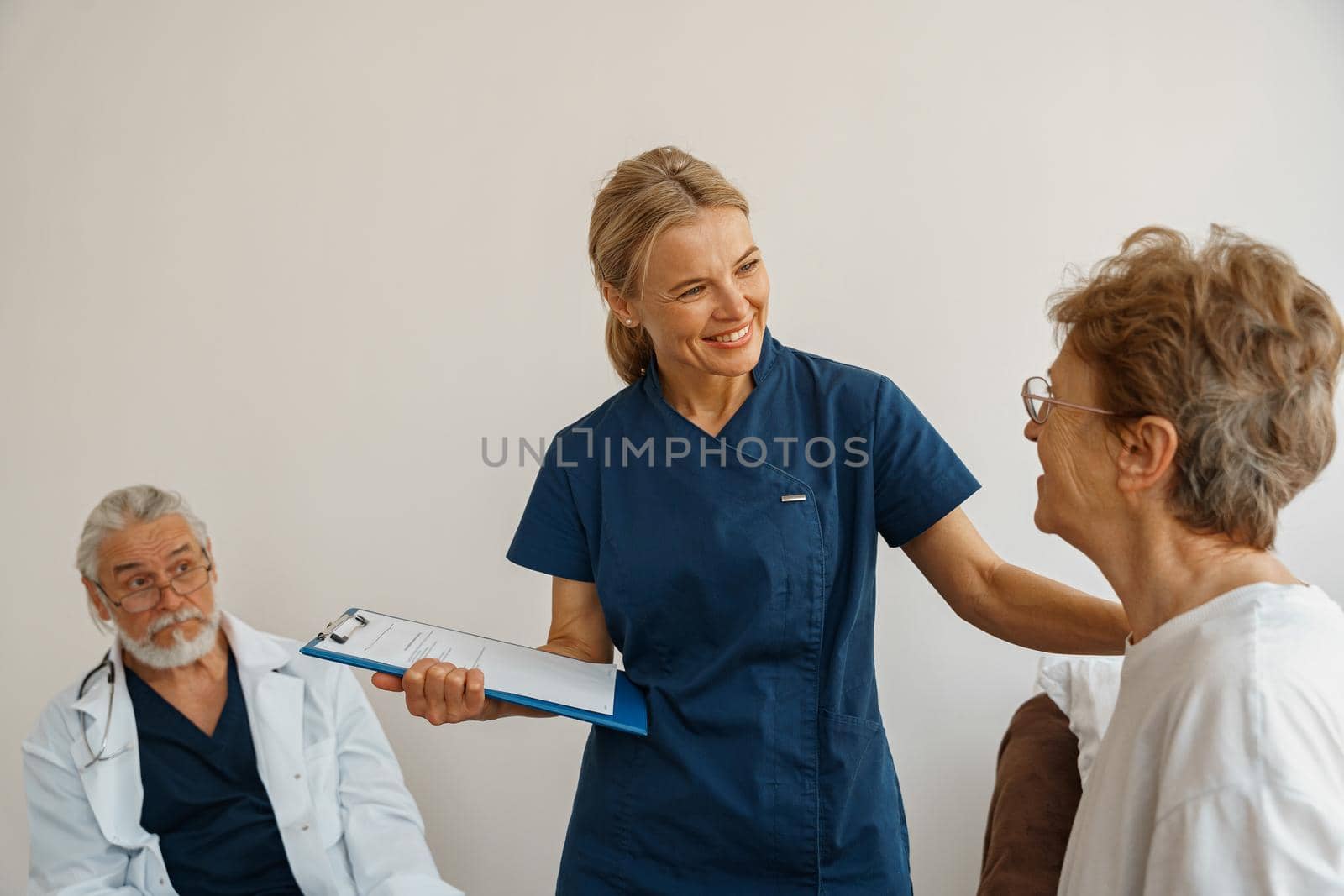 Doctor supporting a sick patient before medical procedures in a hospital room. High quality photo