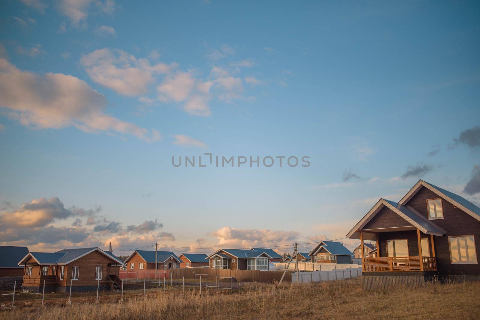 russian village landscape at sunset.