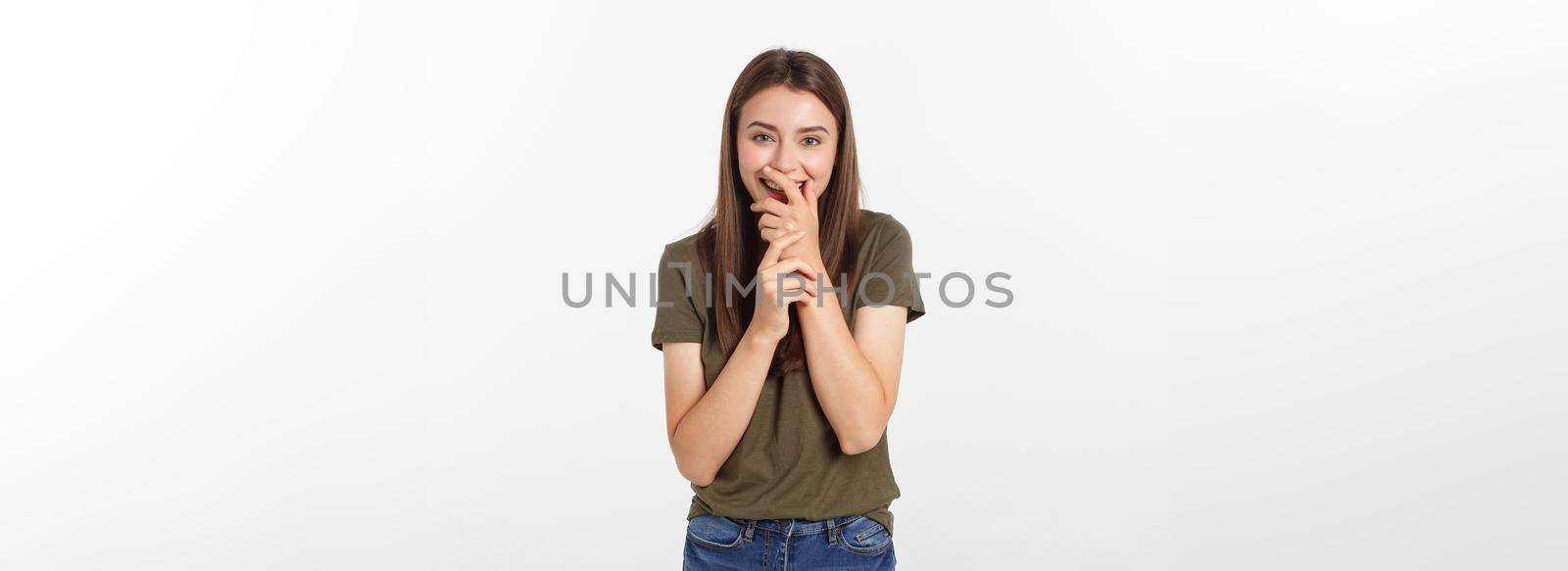 Happy woman laughing covering her mouth with a hands isolate over grey background. by Benzoix
