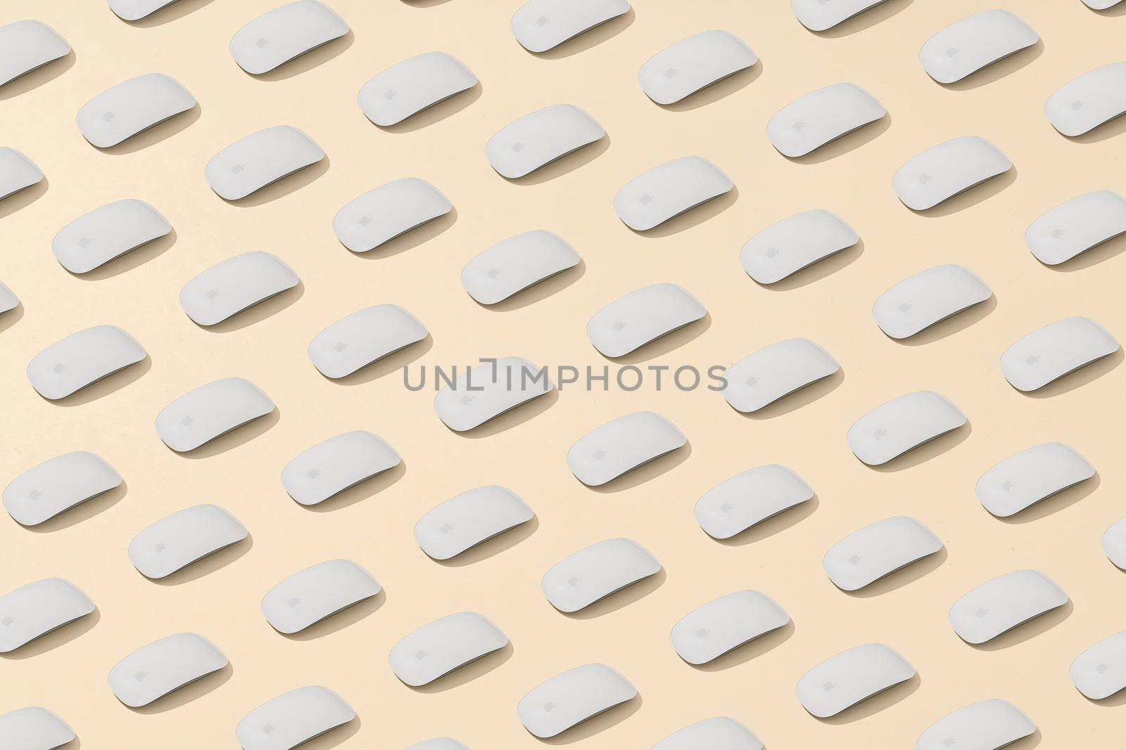 Antalya, Turkey - August 30, 2022: Apple magic mouse lined up isometric on a cream background