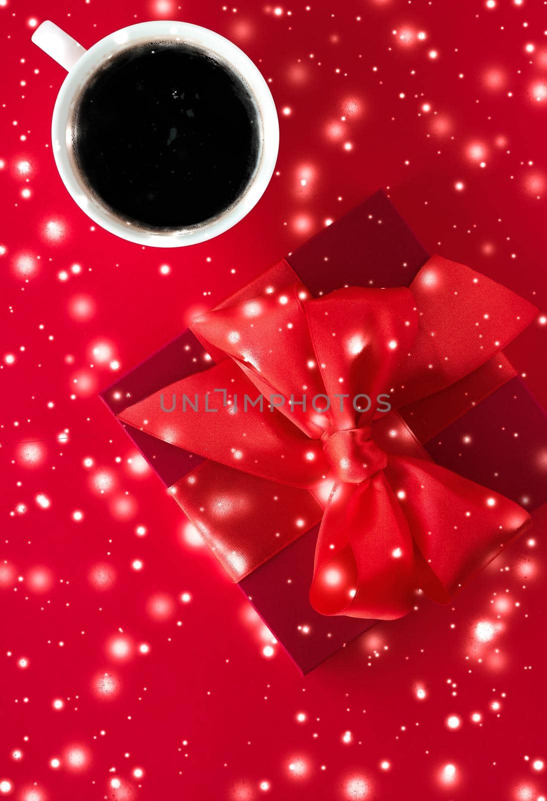 Hot drink, luxury festive menu and Valentines Day card concept - Winter holiday gift box, coffee cup and glowing snow on red flatlay background, Christmas time present surprise