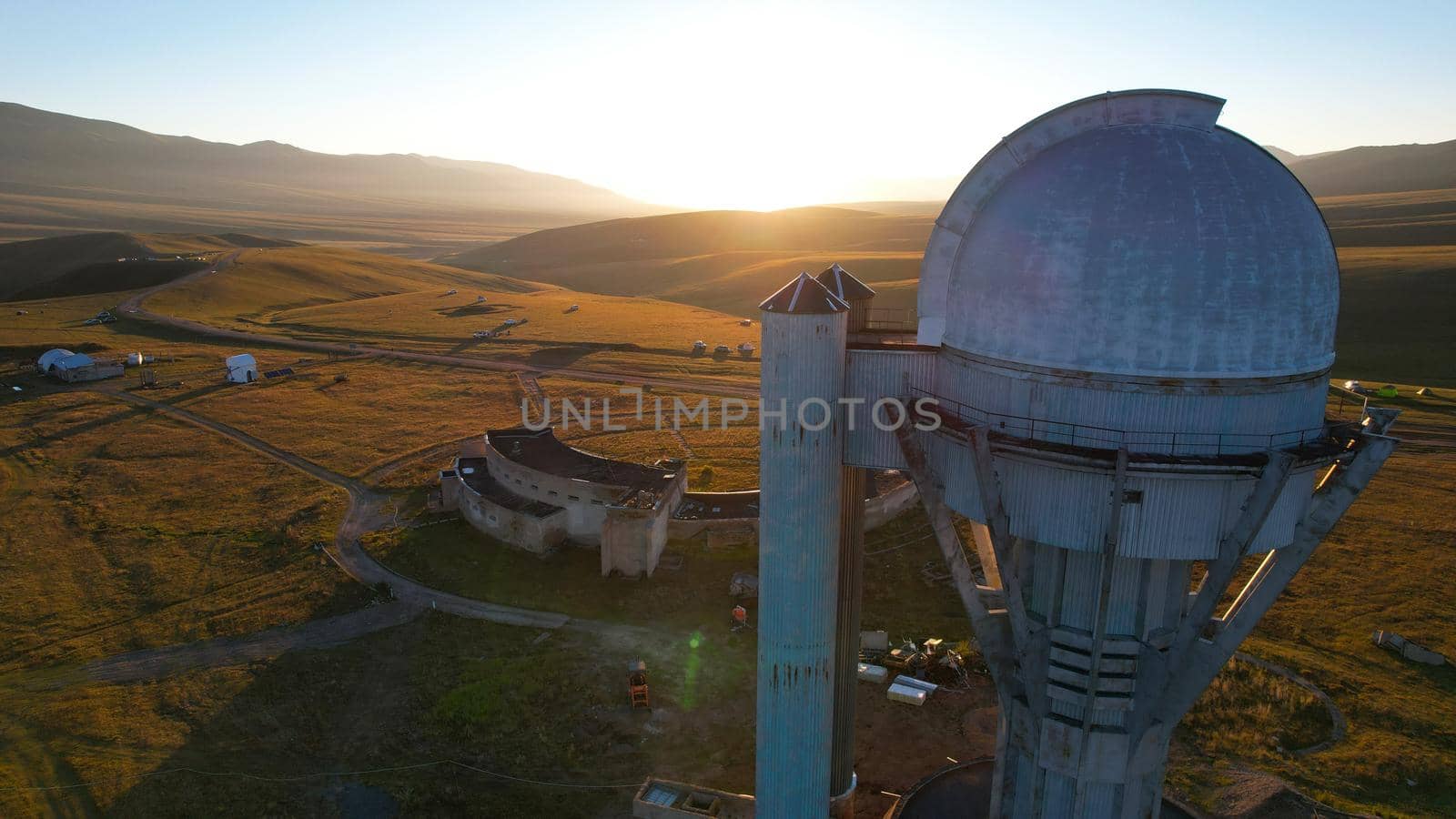 Bright dawn over the observatory in the mountains by Passcal