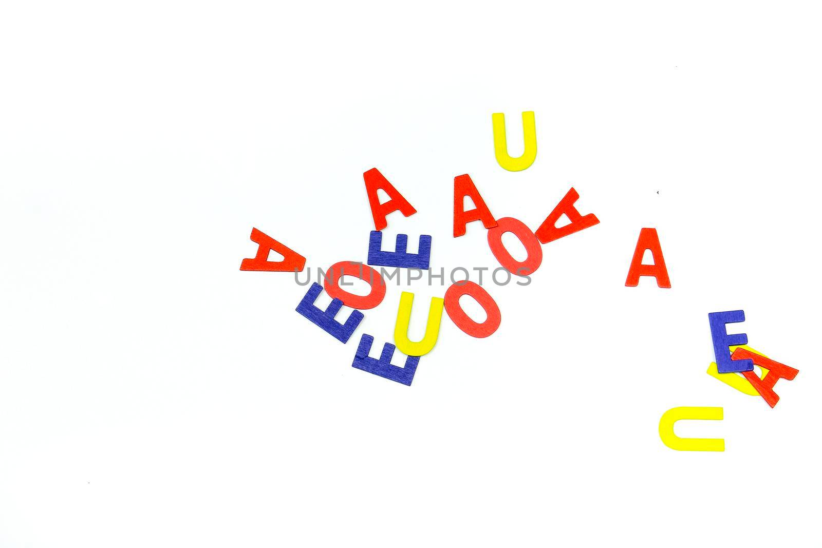 Many Multicolored vowels on white background