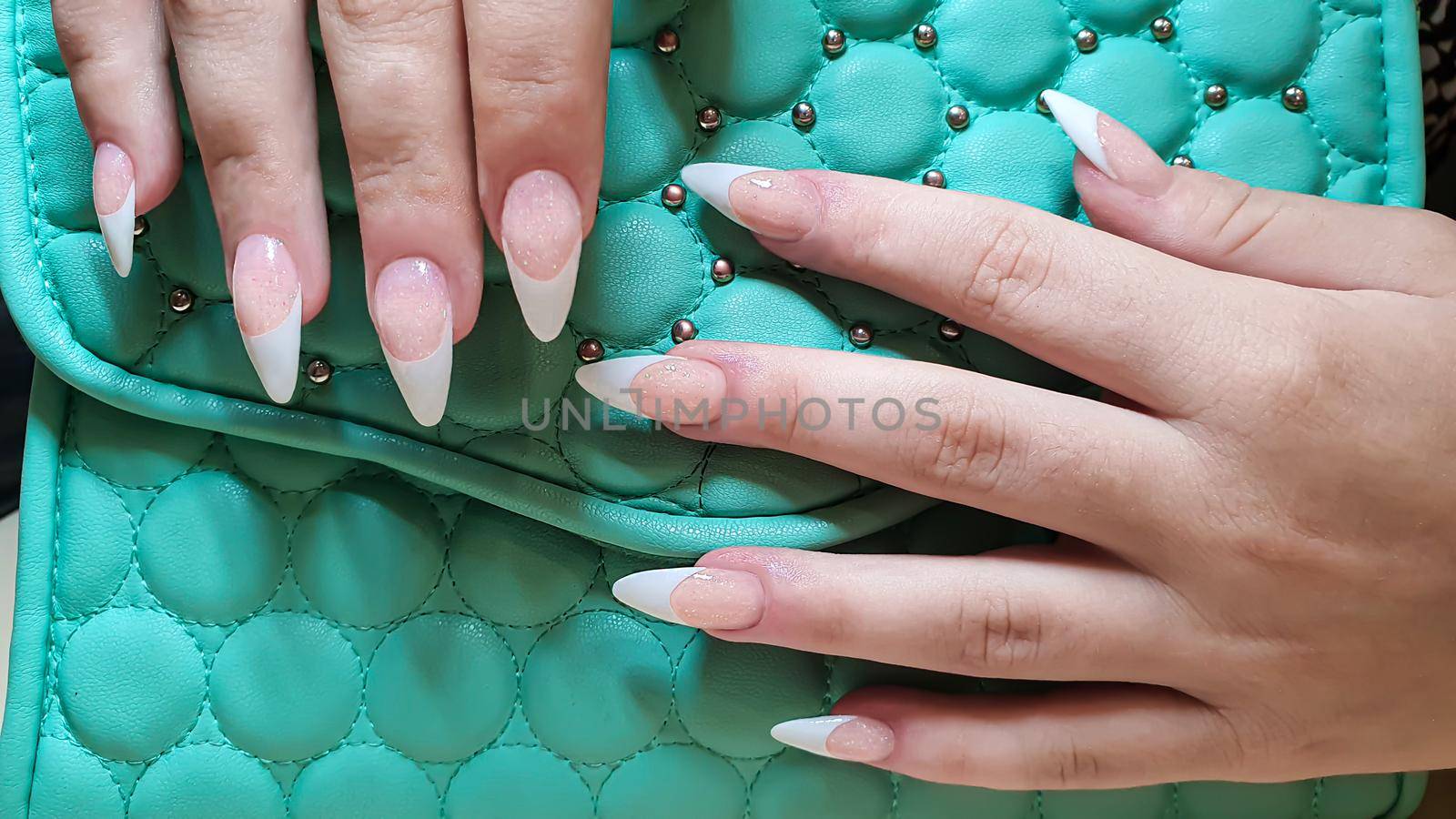 Acrylic nail extension, manicure, nail correction, hands in the foreground. French design. by klimatis019