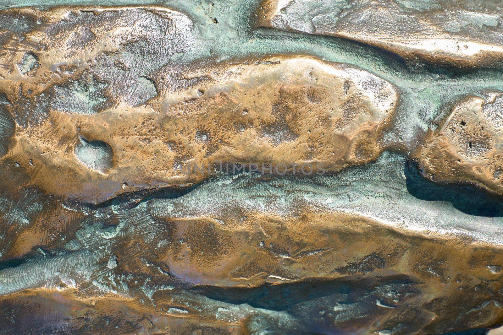 Bronze texture for backgrounds. Grunge metal background close-up. Selective focus