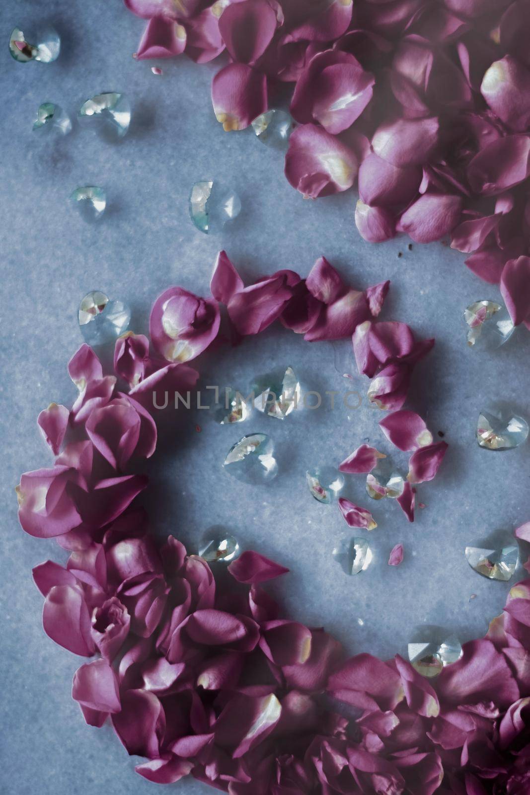 Rose petals on marble stone, floral background by Anneleven