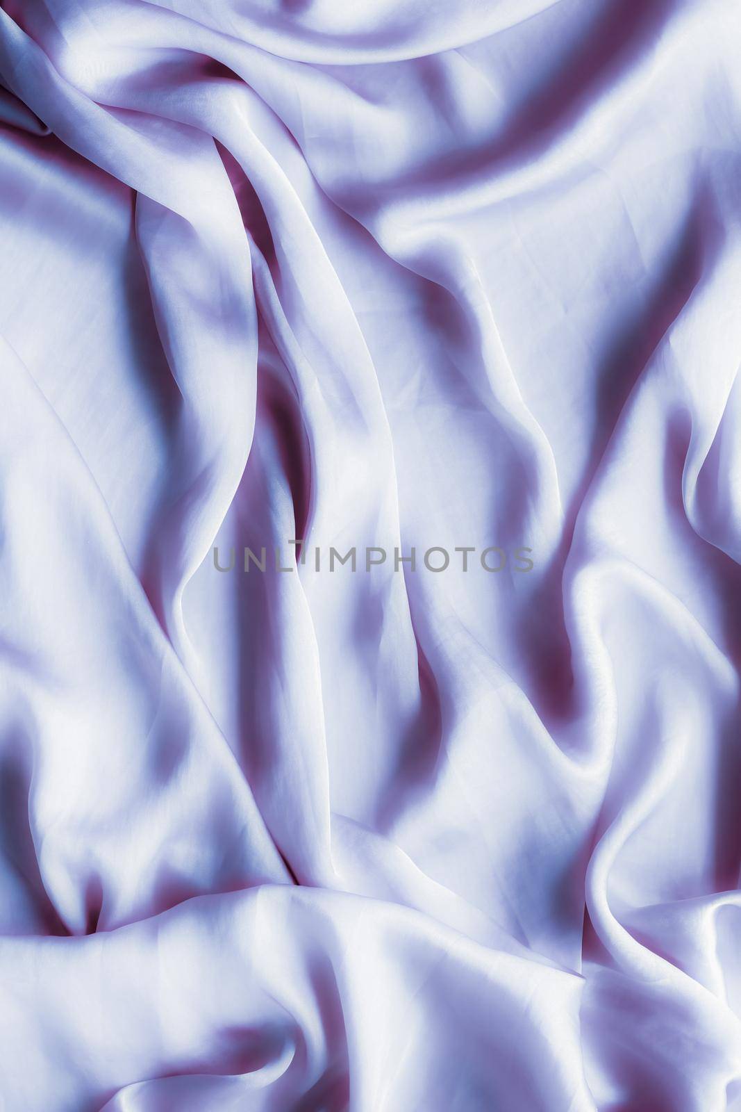 Elegant fabric texture, abstract backdrop and modern pastel colours concept - Purple soft silk waves, flatlay background