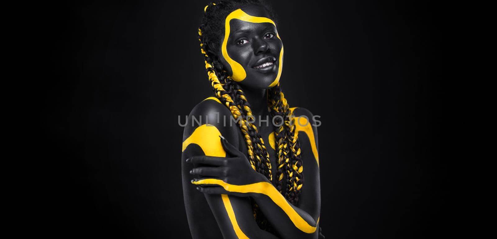 Yellow and black body paint. Woman with face art. Young girl with bodypaint. An amazing model with makeup. by MikeOrlov