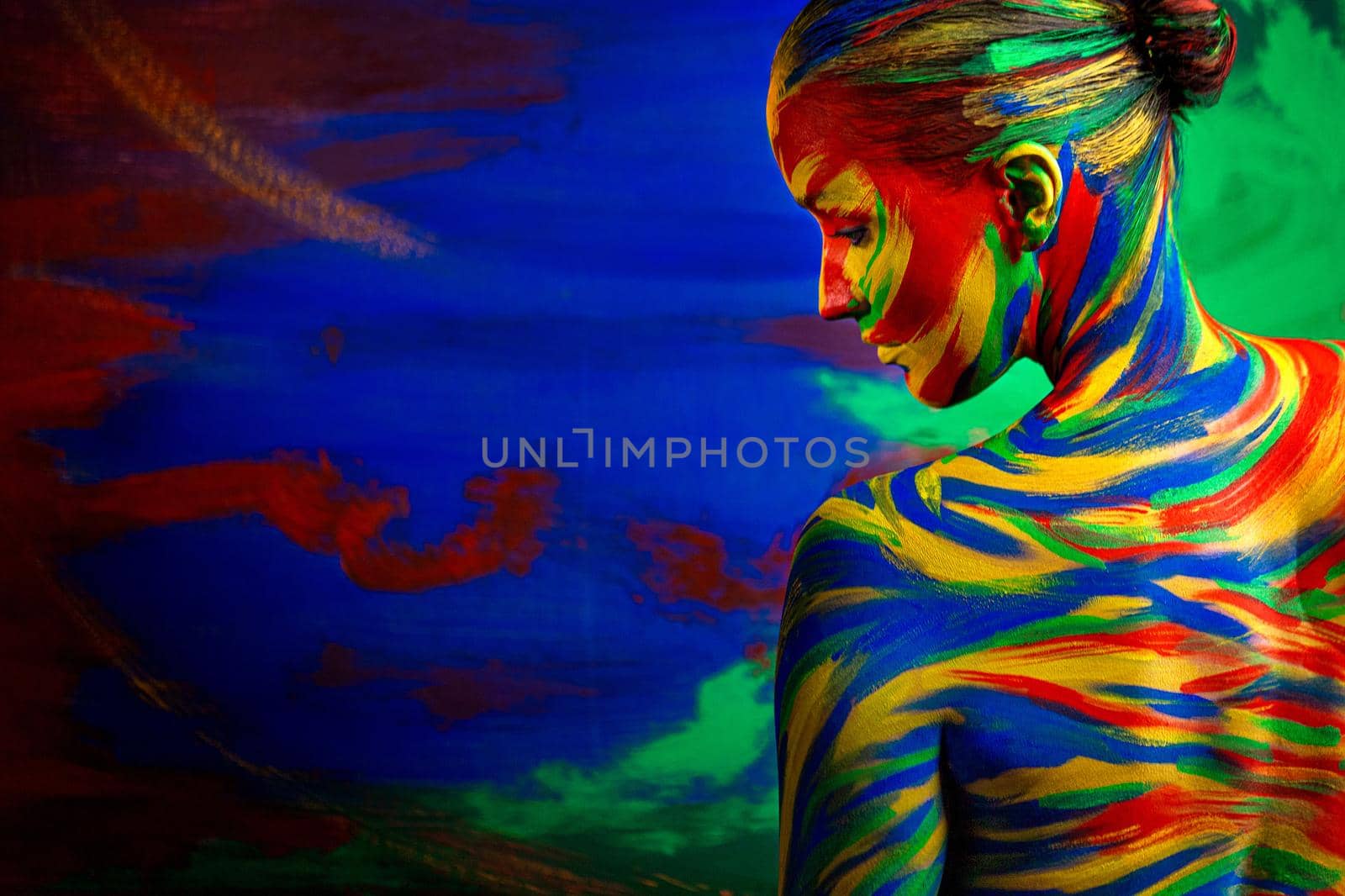 Color art face of woman for inspiration. Abstract portrait of the bright beautiful girl with colorful make-up and bodyart. by MikeOrlov