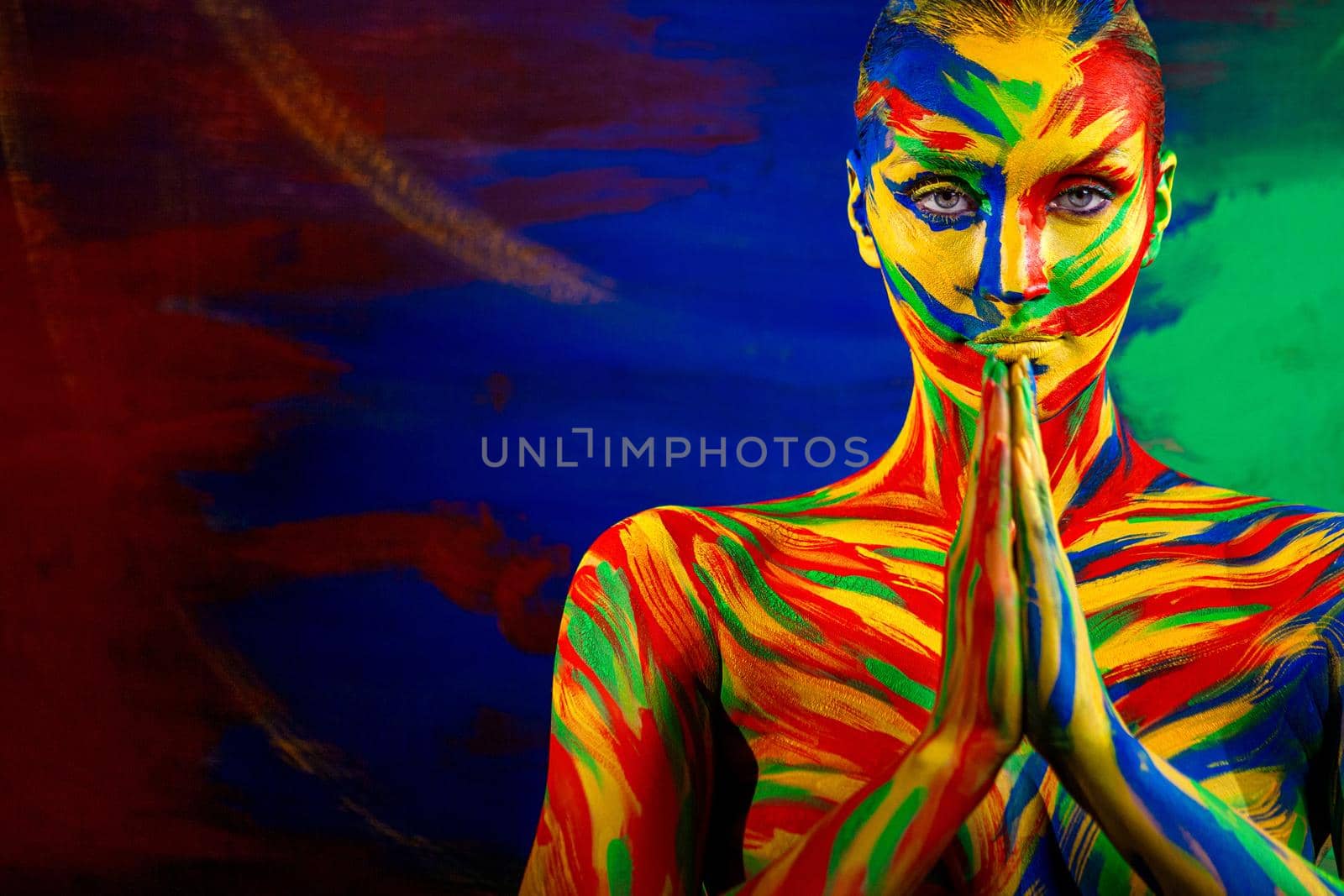 Portrait of the bright beautiful emotional woman with art make-up