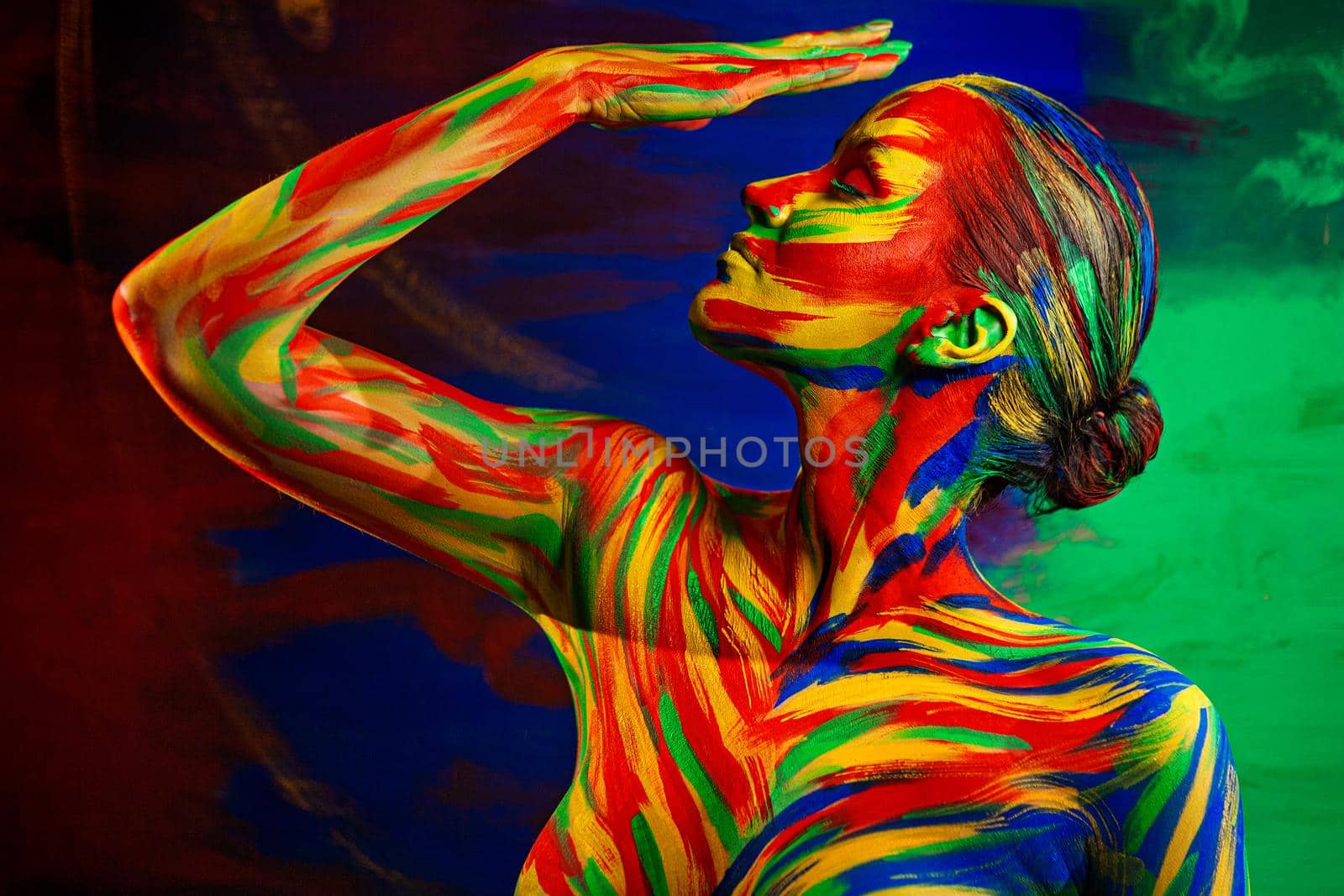 Color art face of woman for inspiration. Abstract portrait of the bright beautiful girl with colorful make-up and bodyart. by MikeOrlov