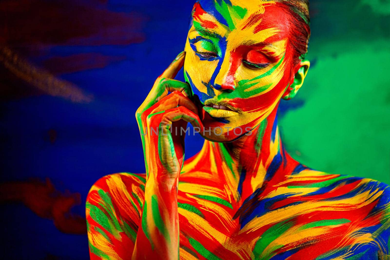 Art fashion makeup and body paint. Color face of woman for inspiration. Abstract portrait of the bright beautiful girl with colorful make-up and bodyart. by MikeOrlov
