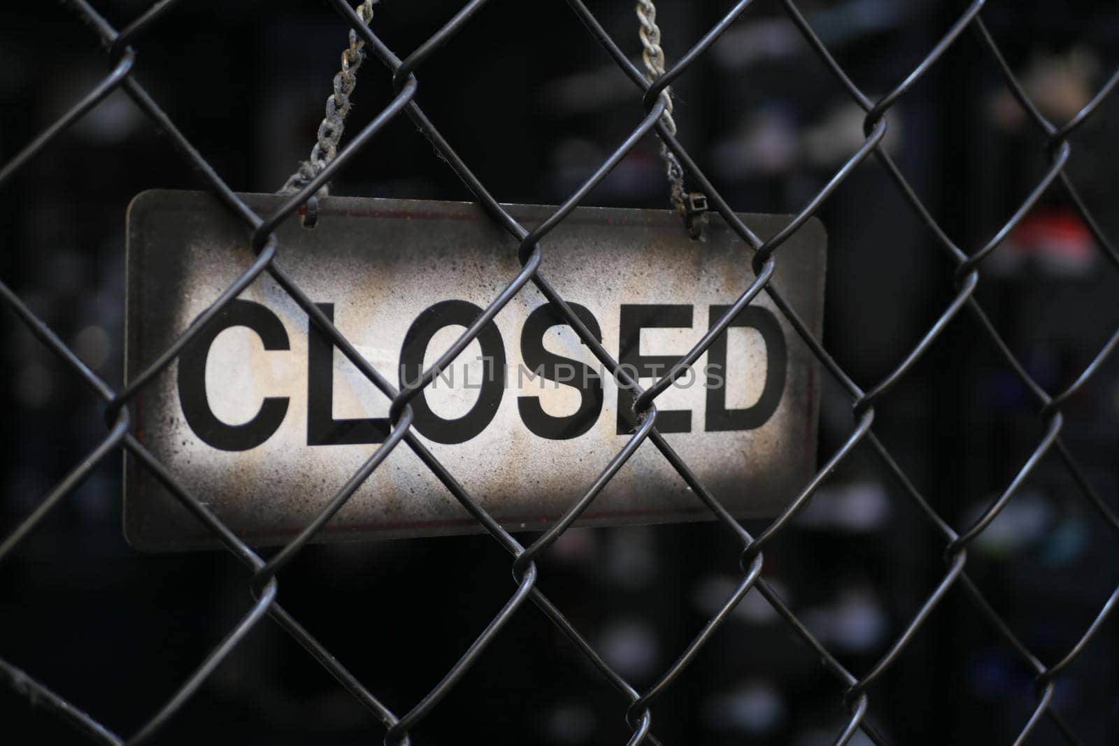 closed sign hanging on door of cafe