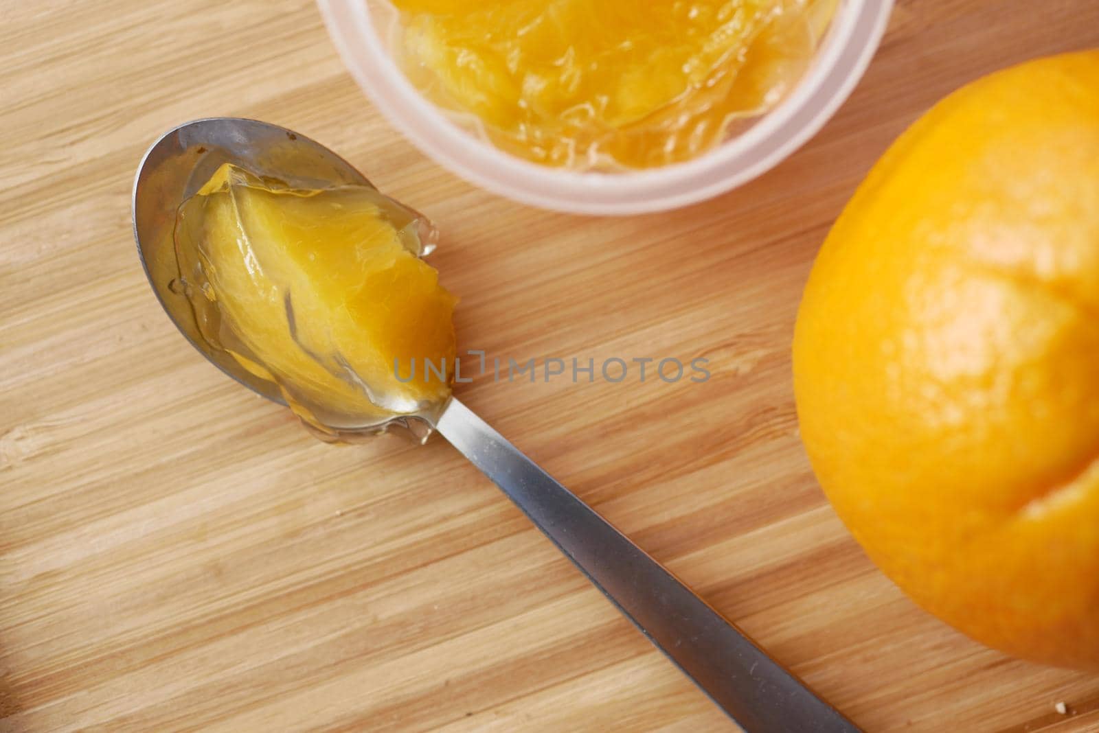 colorful orange flavor jelly on plate on table
