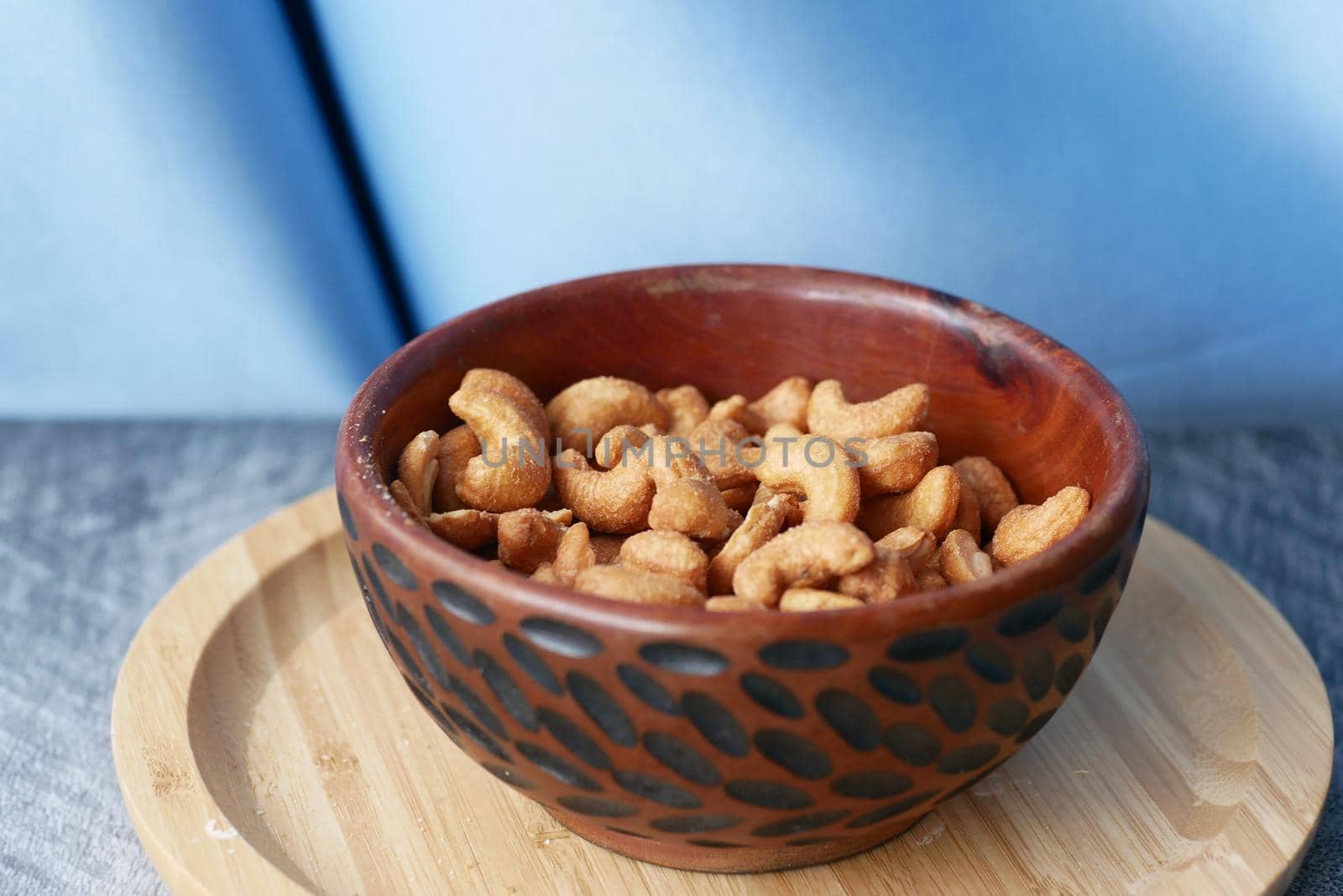 close up of cashew nuts in a bowl on table ,
