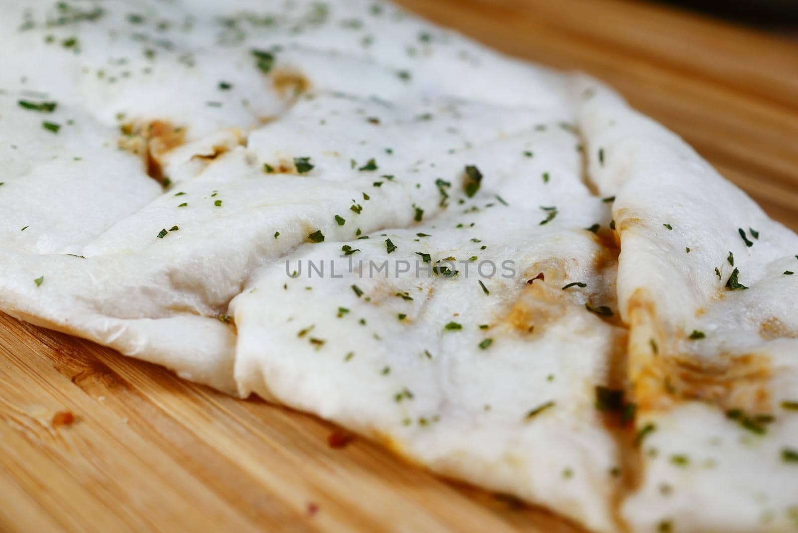nan bread on a wooden board ,