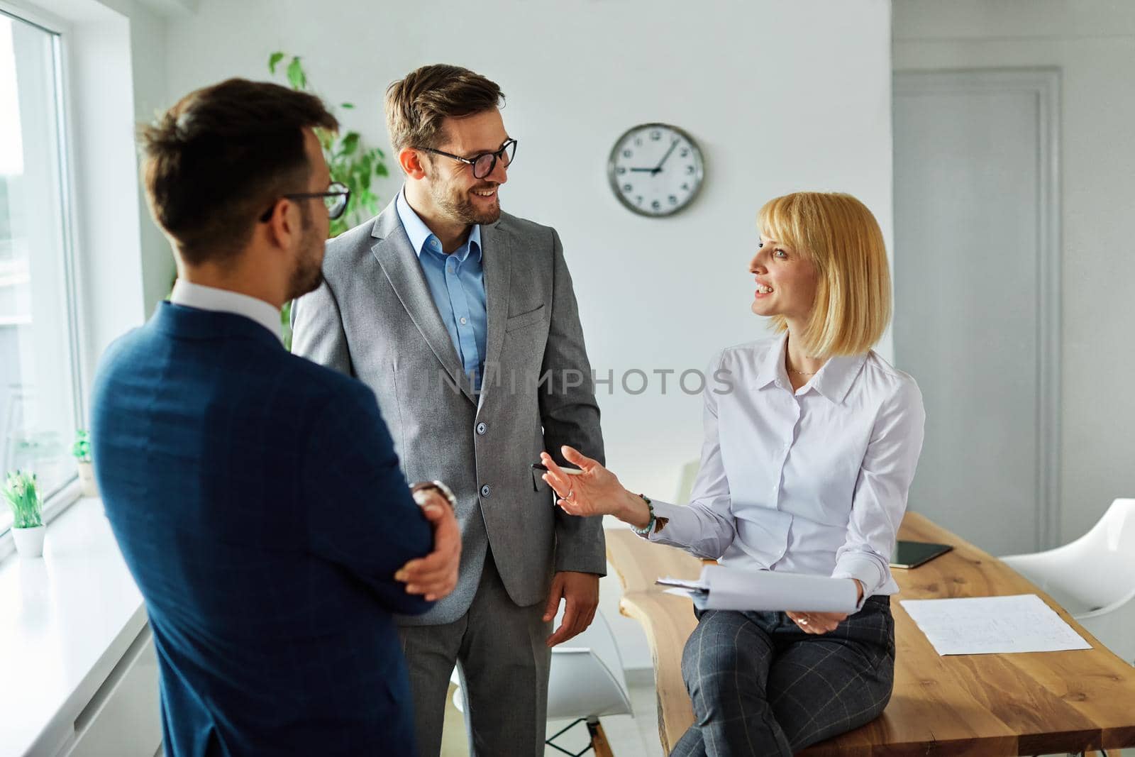 young business people meeting office teamwork group success corporate discussion team group desk businesswoman document file planning by Picsfive