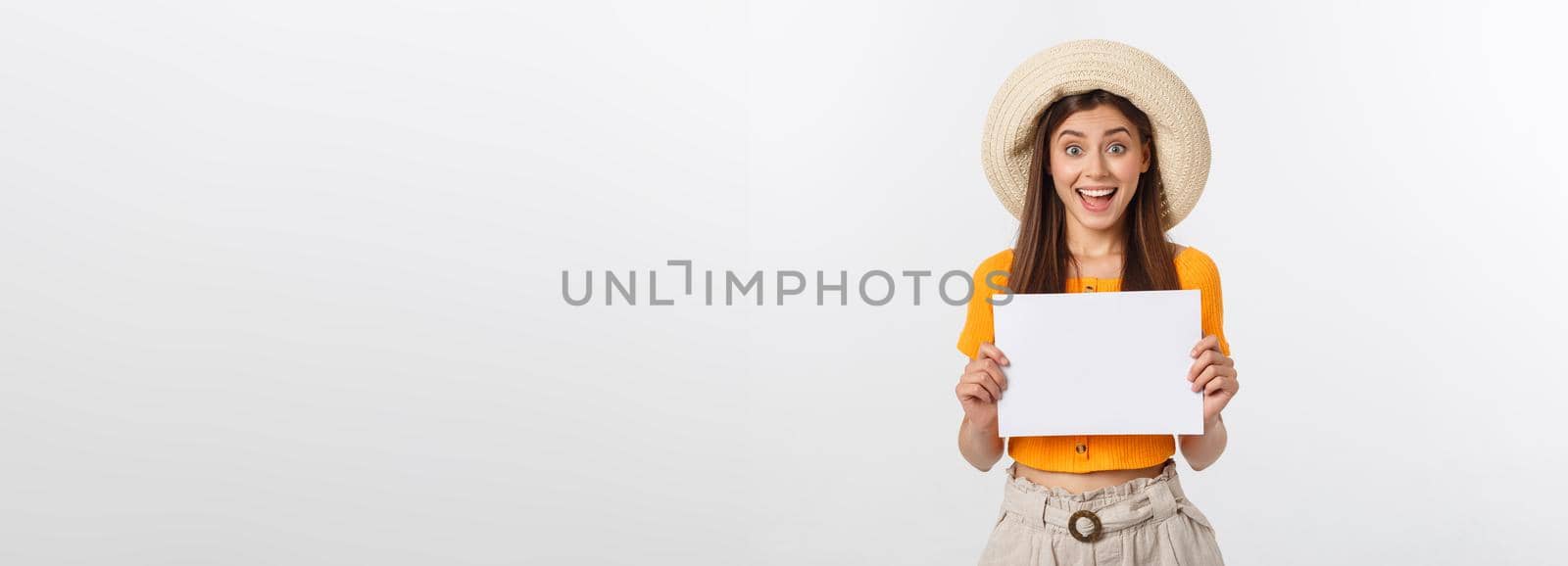 Woman holding blank card. Isolated on white background smiling female portrait by Benzoix