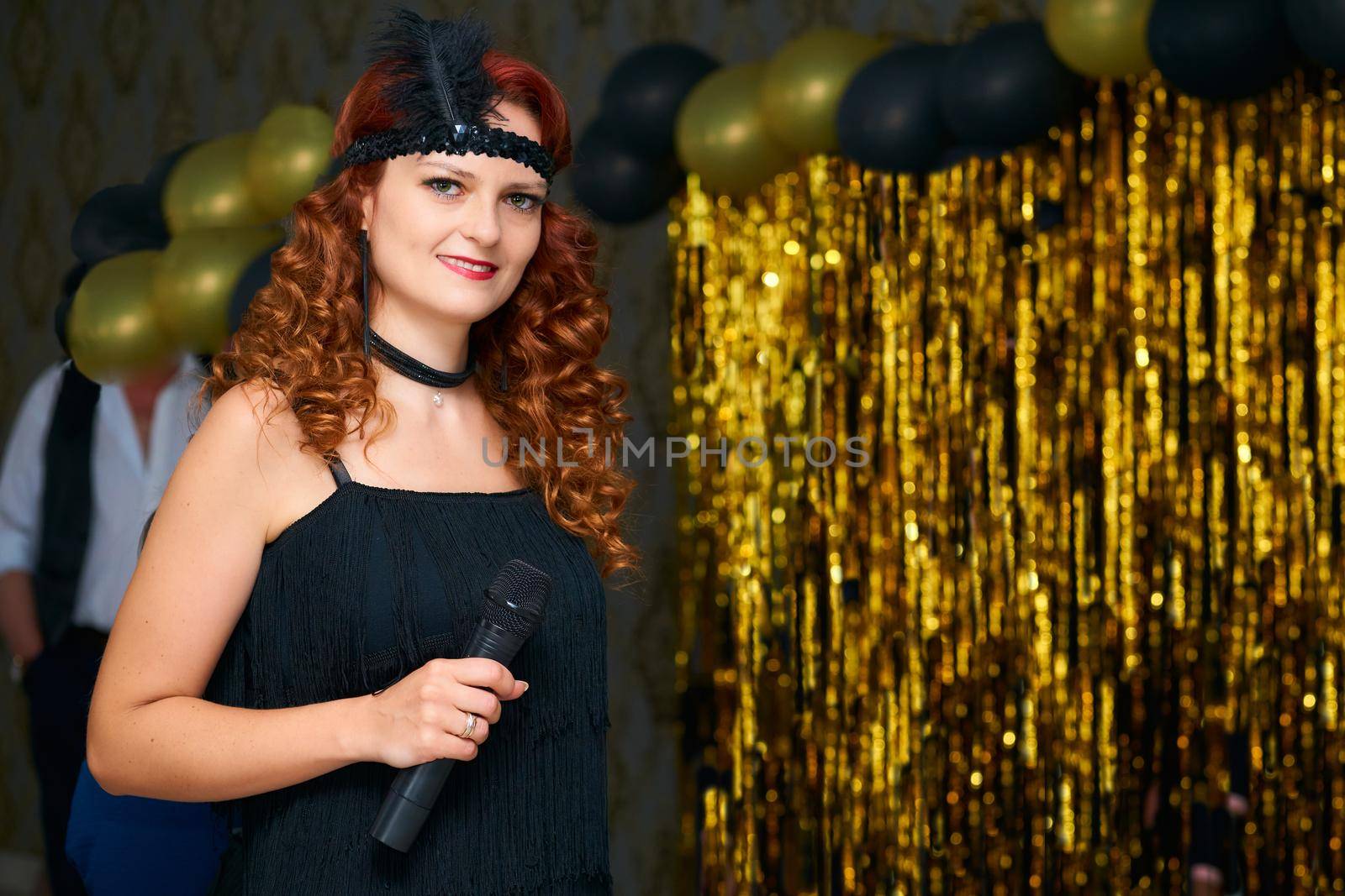 Cute event host woman, wedding presenter in black in vintage style on a gold by jovani68