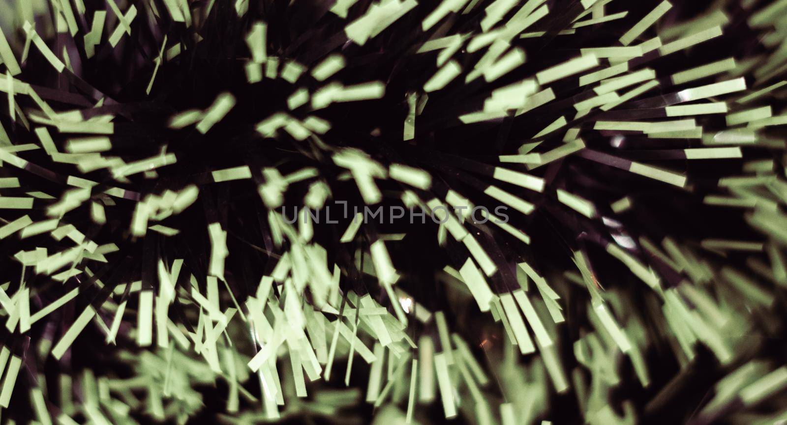 BANNER Abstract defocused dark black background. Tinsel Phantom, matte tone light green color chips like spray fireworks. Christmas decoration new year. Wallpaper screensaver.