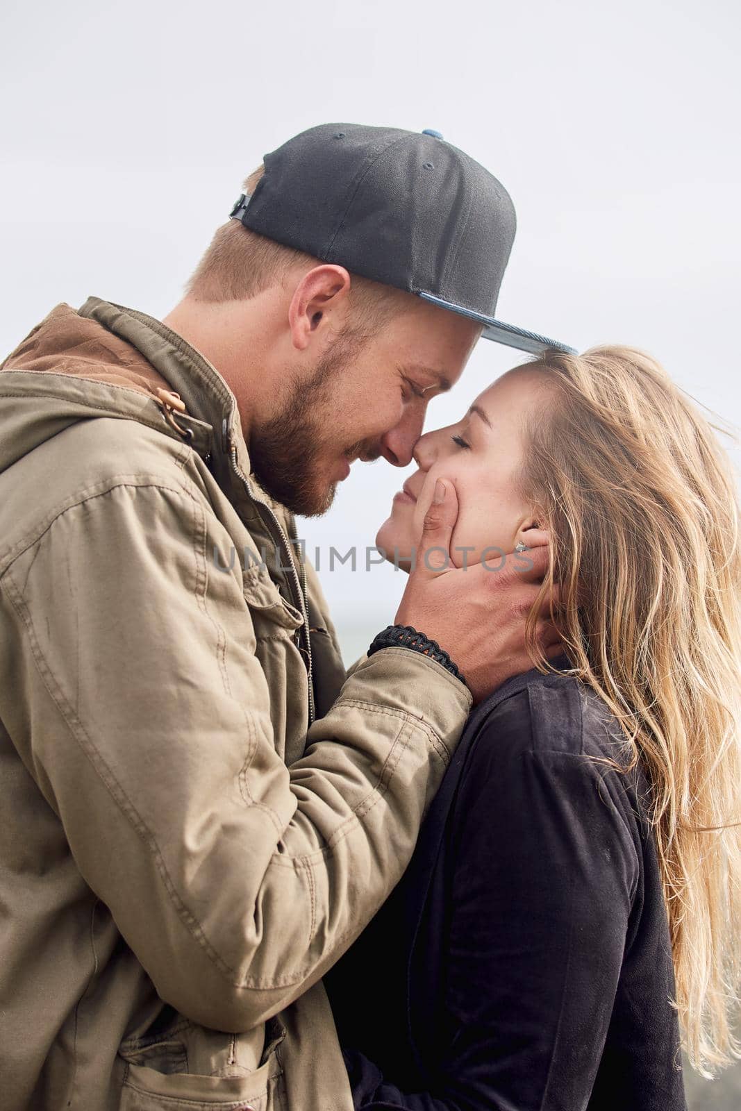 Lost in the moment. an affectionate young couple spending time together outdoors