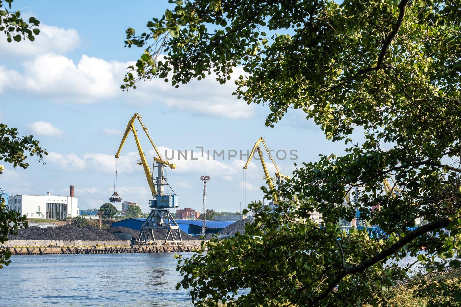 Vyborg, Leningrad region, Russia. - August 27, 2022. View of the commercial port with cargo cranes. Selective focus.