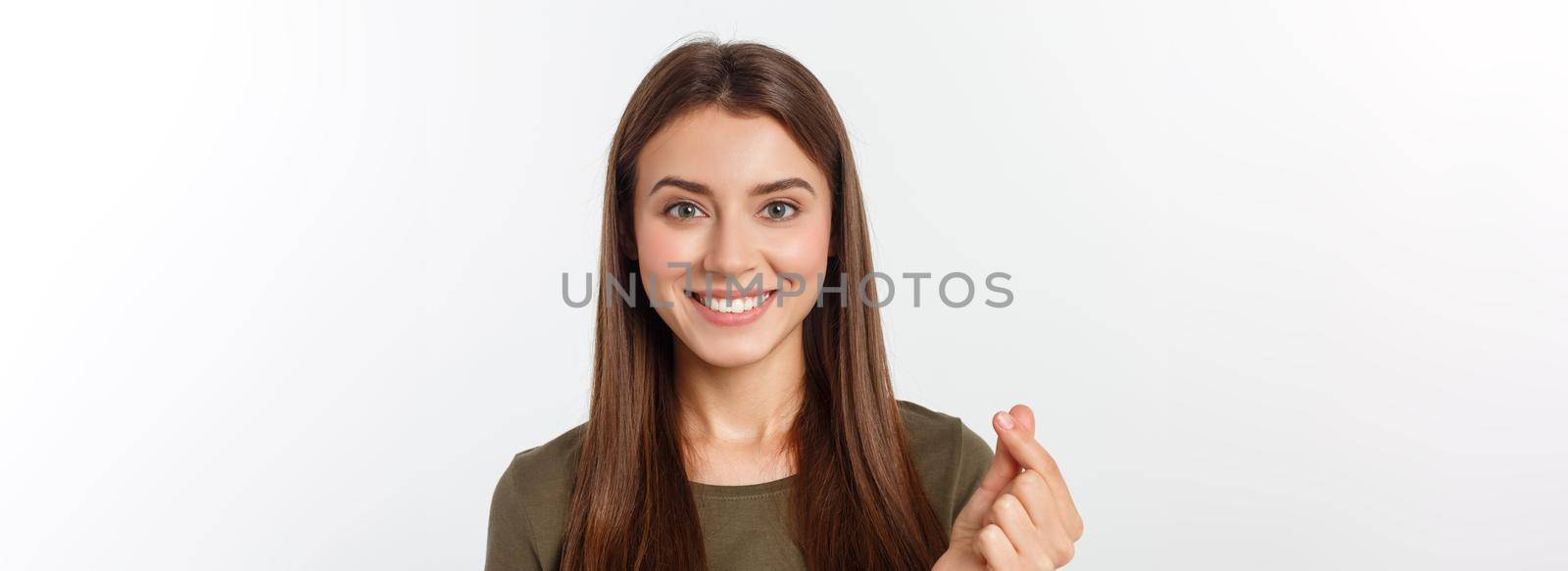 Pretty caucaisan female teenager standing and smiling over white background by Benzoix