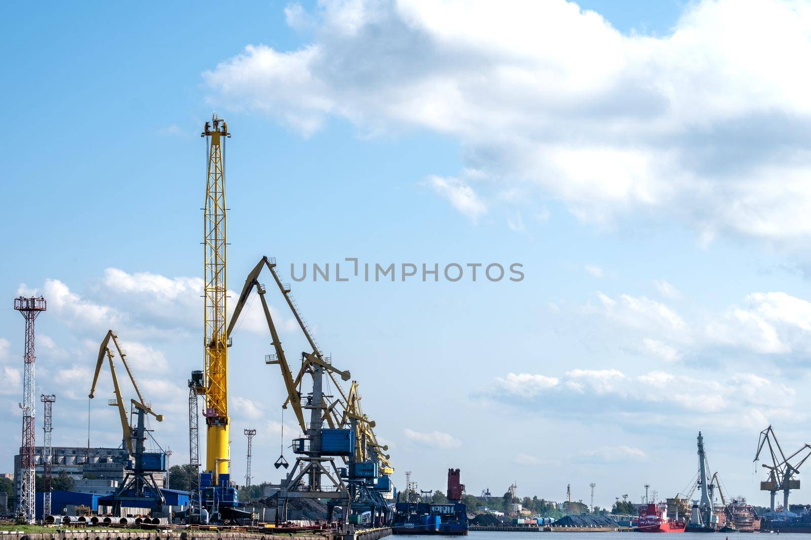 Vyborg, Leningrad region, Russia. - August 27, 2022. View of the commercial port with cargo cranes. Selective focus.